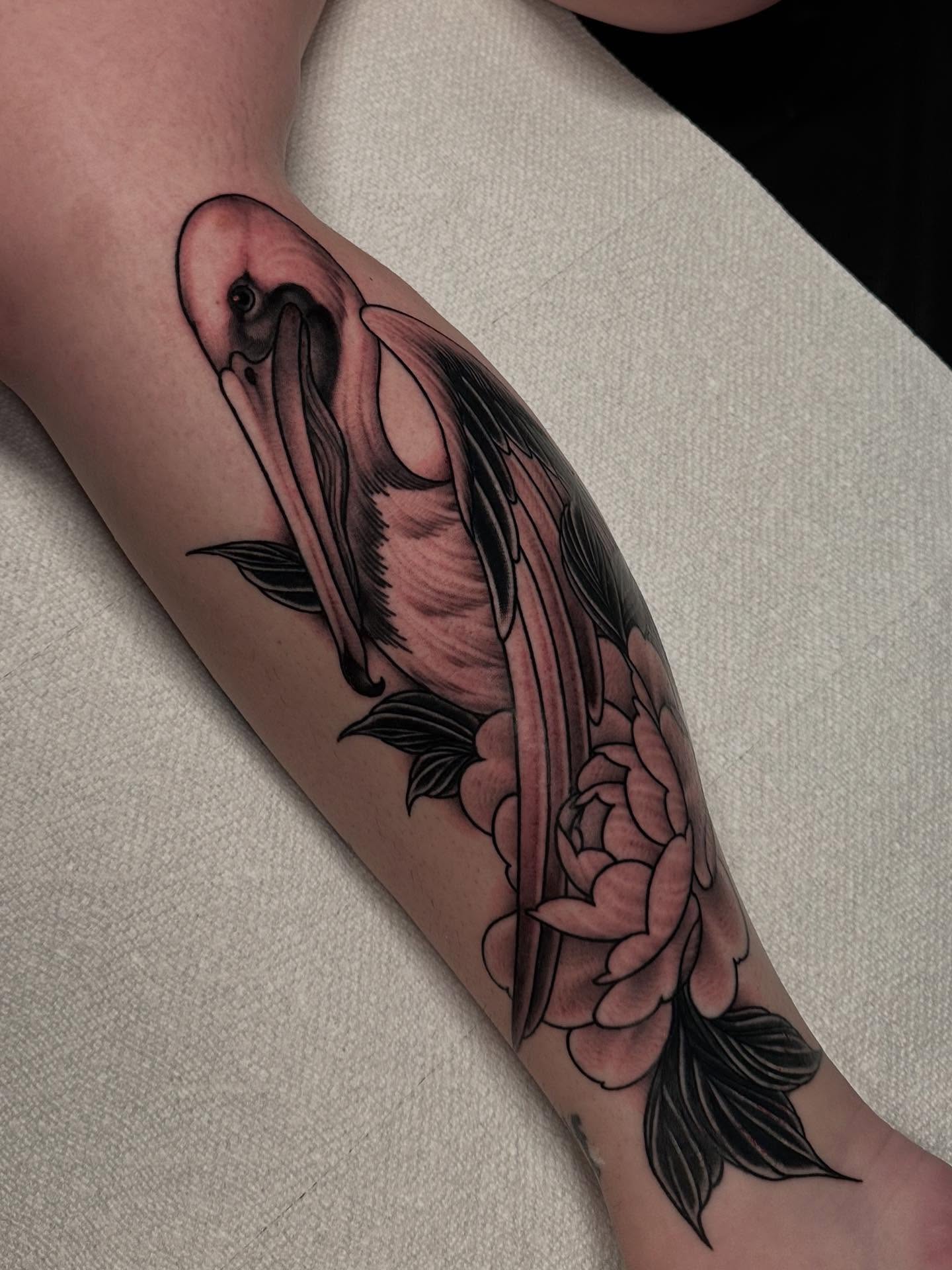 Koi fish and peony American traditional tattoo on the forearm by Henry Gaßner