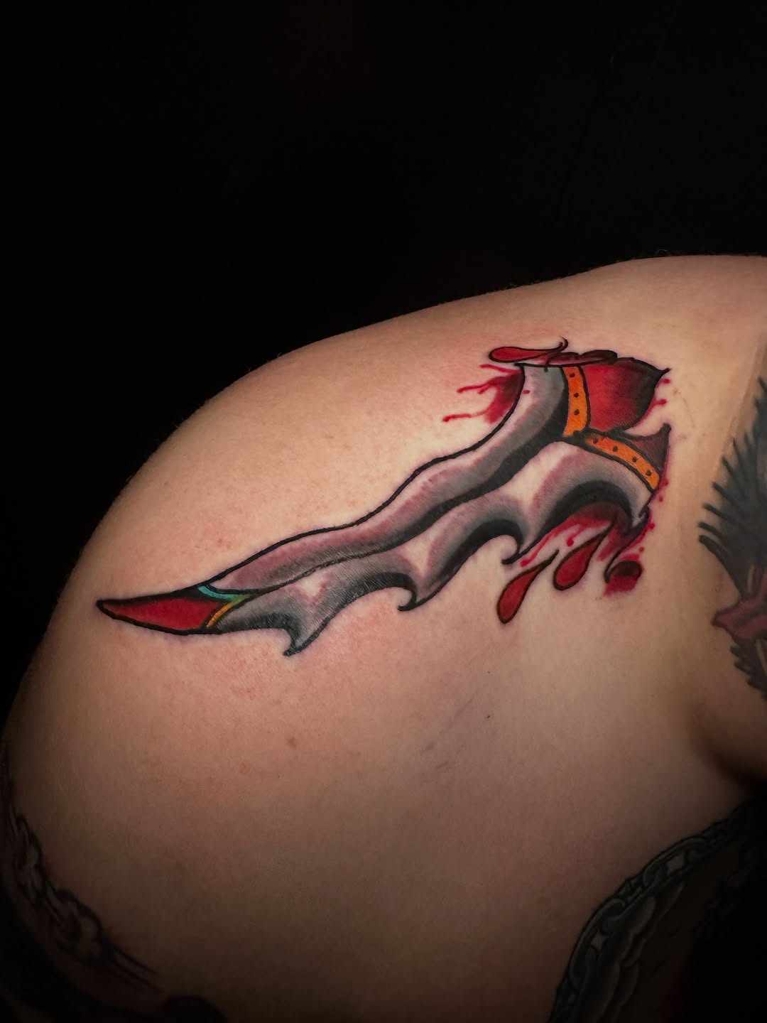 Dagger with blood American traditional tattoo on the shoulder by vannadoestattoos