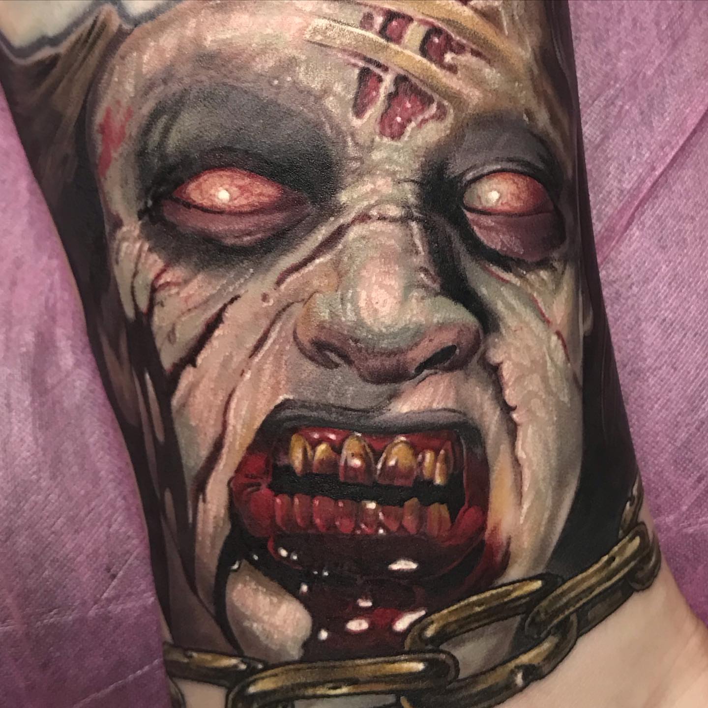 Zombie dark realism tattoo on the forearm by Rick Rayne