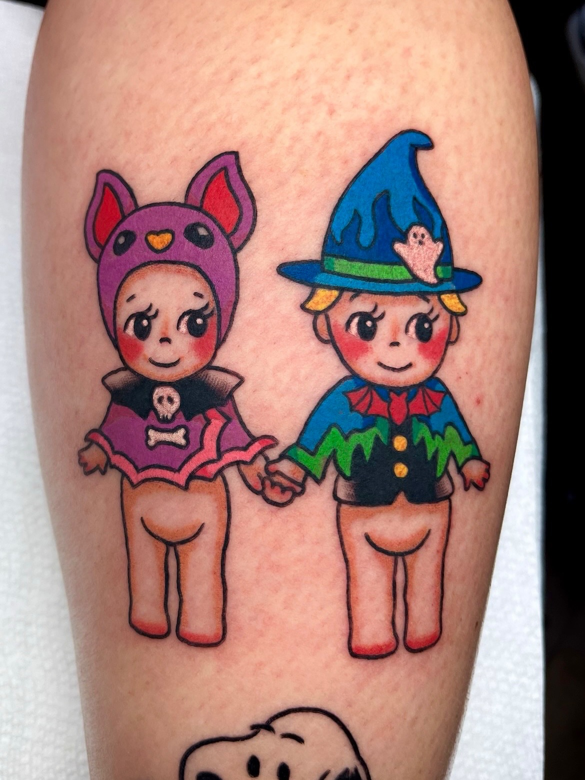 Costumed characters anime tattoo on the forearm by Alena McDonald