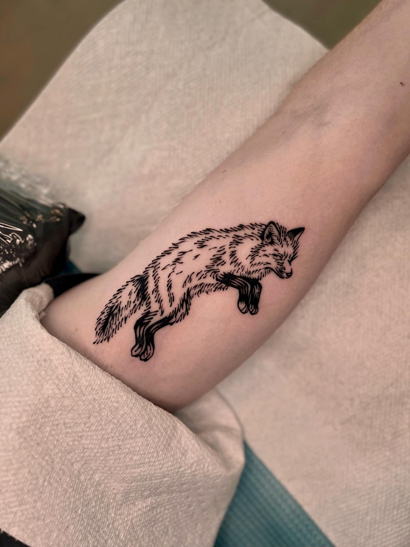 Fox black and grey tattoo on the forearm by Wonny