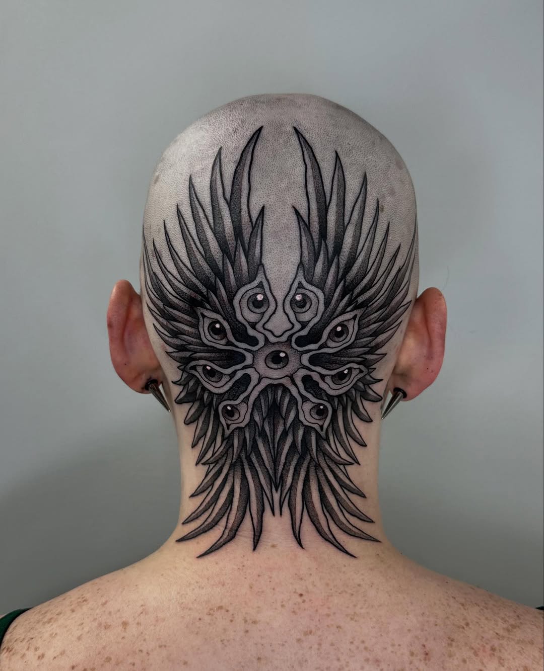 Biblically accurate angel cyber sigilism tattoo on the head by Brooklyn Bailey