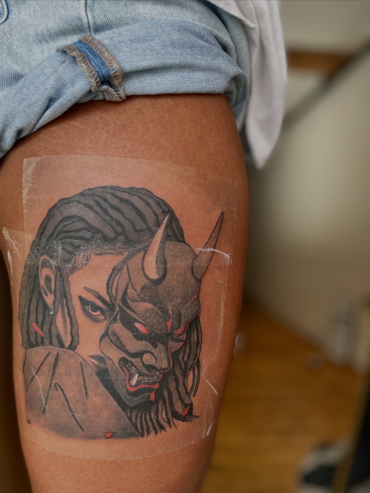 Demon mask American traditional tattoo on the thigh by Koolz