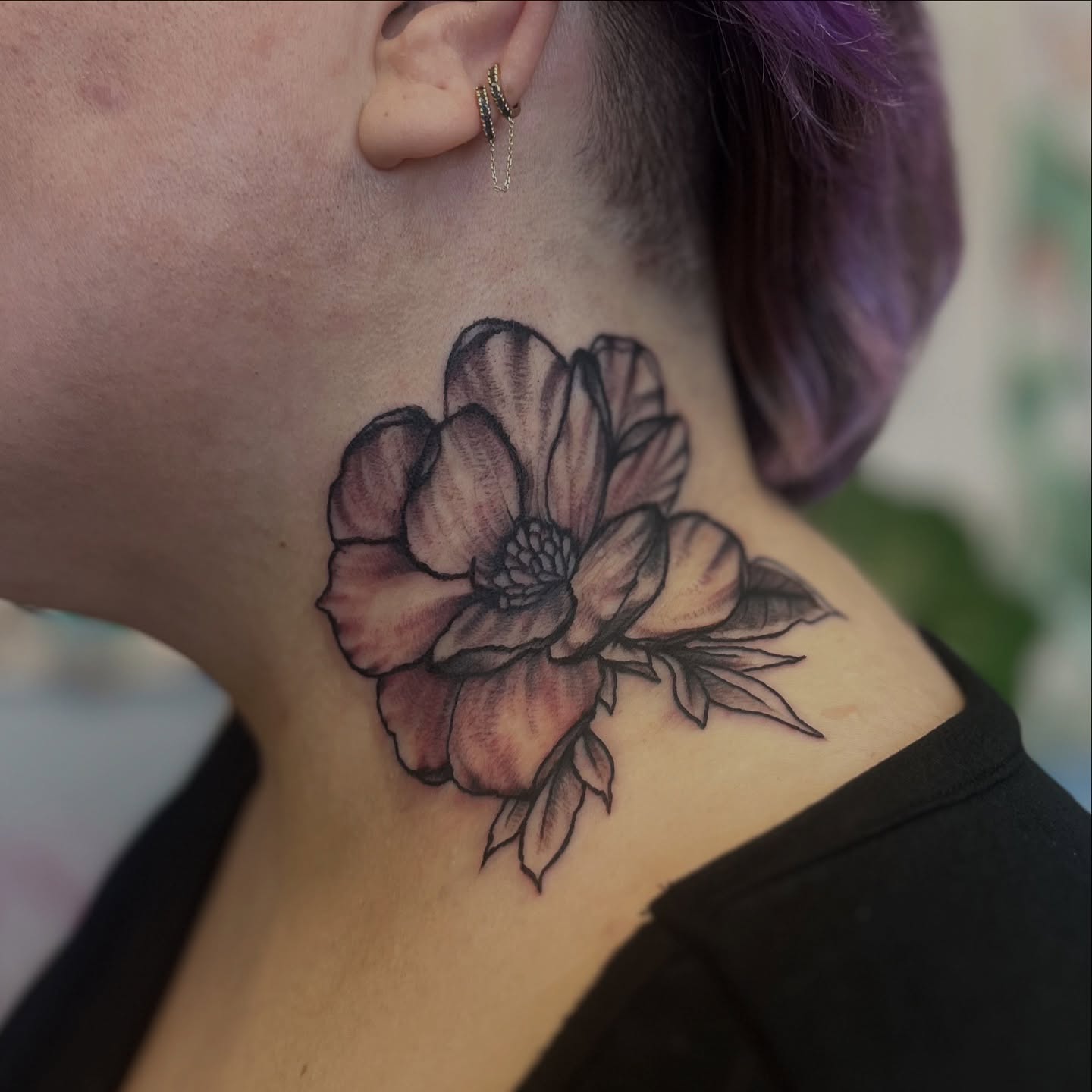 Flower black and grey tattoo on the neck by Garden Glow Tattoo