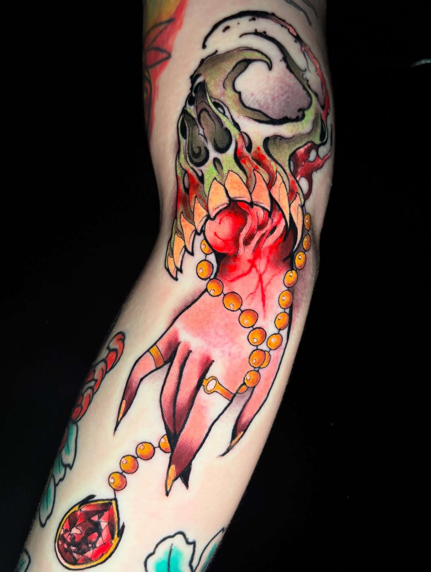 Hand with beads American traditional tattoo on the forearm by Matt Stolzenburg