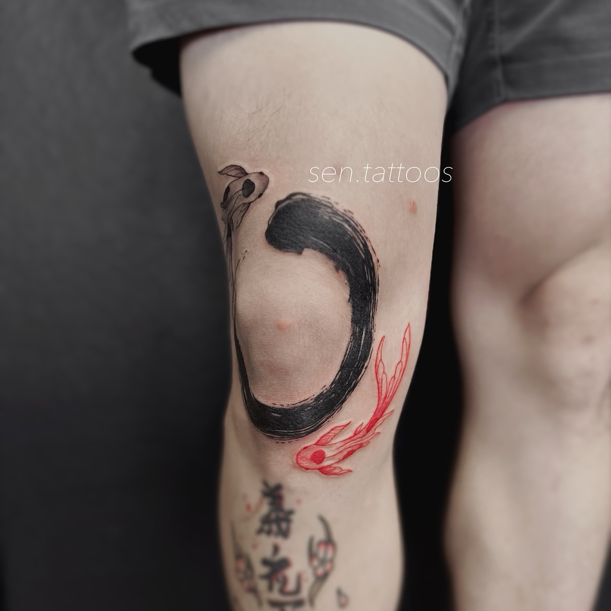 Circle and fish black and grey tattoo on the forearm by Sen Tattooer