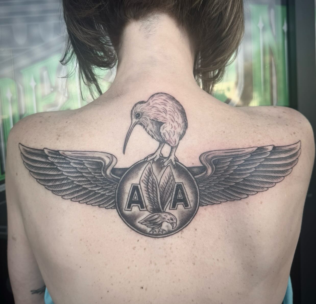 Kiwi bird black and grey tattoo on the back by Jianna