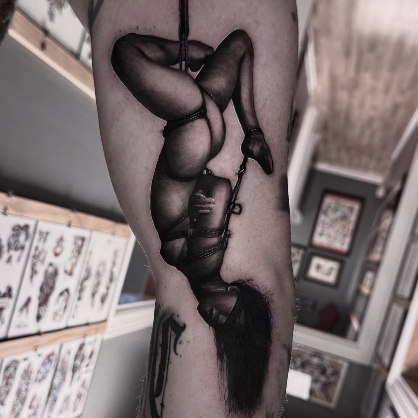 Woman in lingerie realism tattoo on the forearm by Jake Fujimura