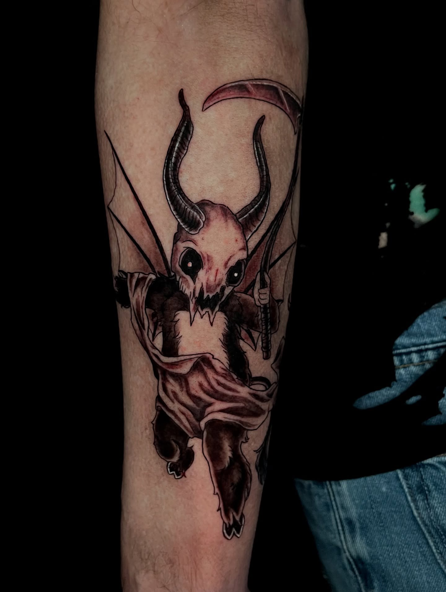 Demon skull dark realism tattoo on the forearm by Jessica Burridge