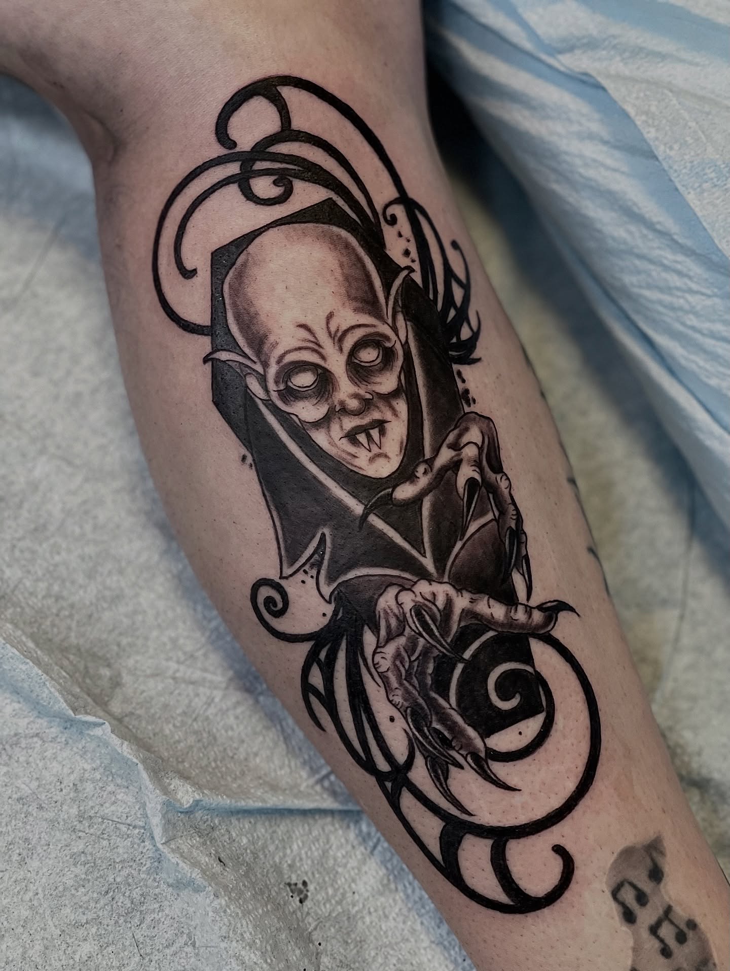 Alien creature dark realism tattoo on the forearm by Jessica Burridge