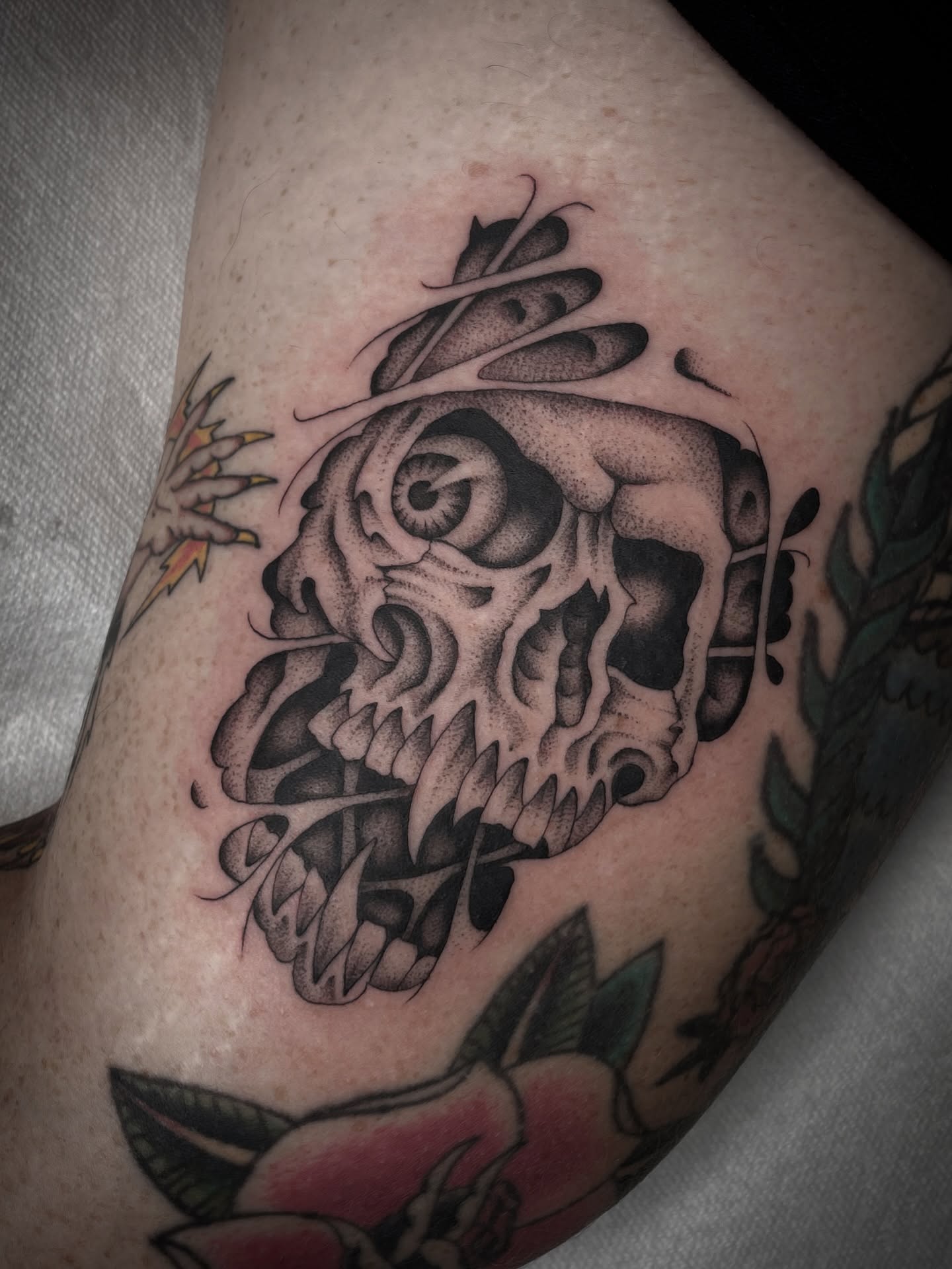 Skull dotwork tattoo on the thigh by Dakota Jenner