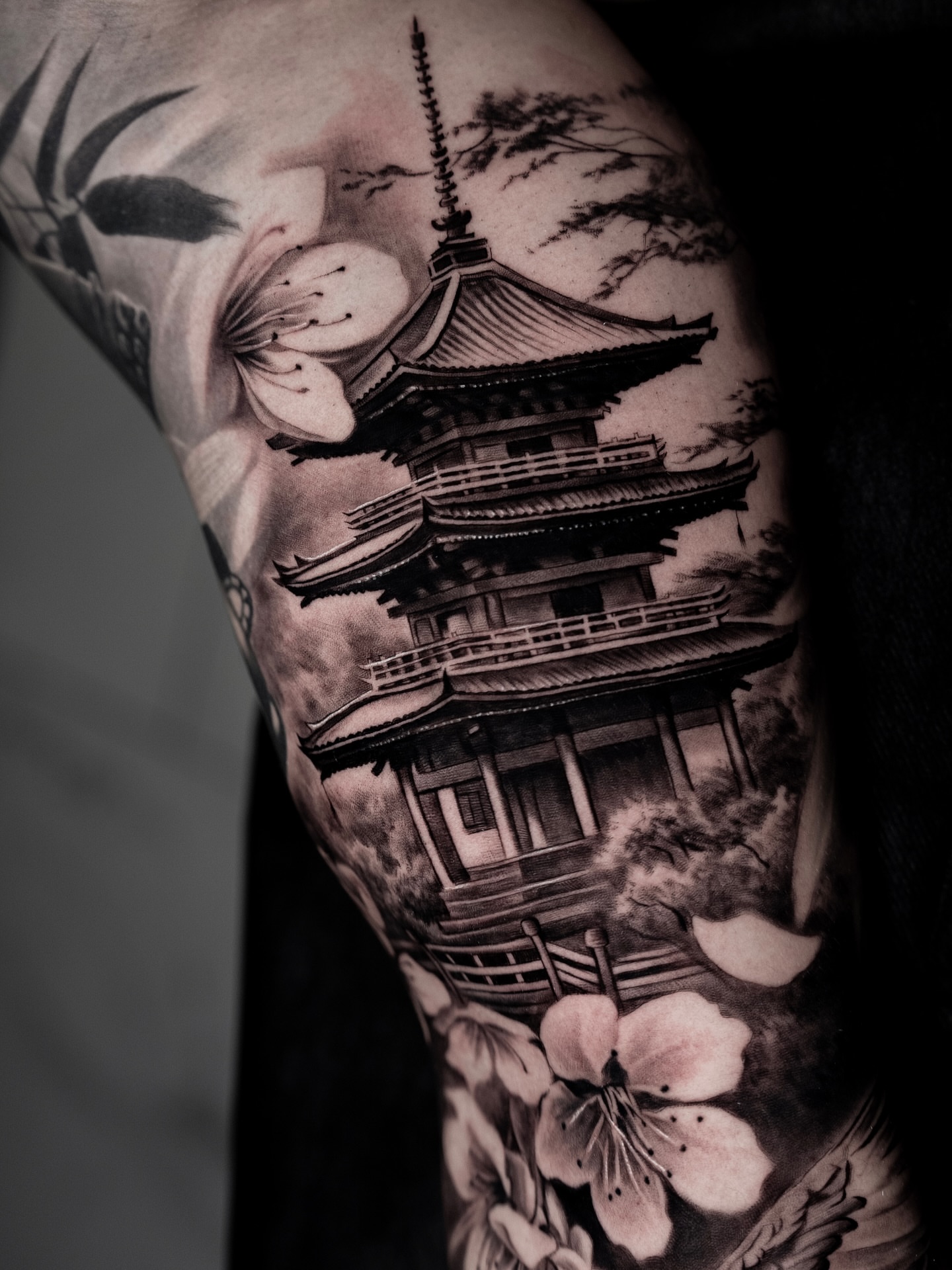Cherry blossom pagoda realism tattoo on the forearm by Lynn Hoang, Honolulu, Hawaii