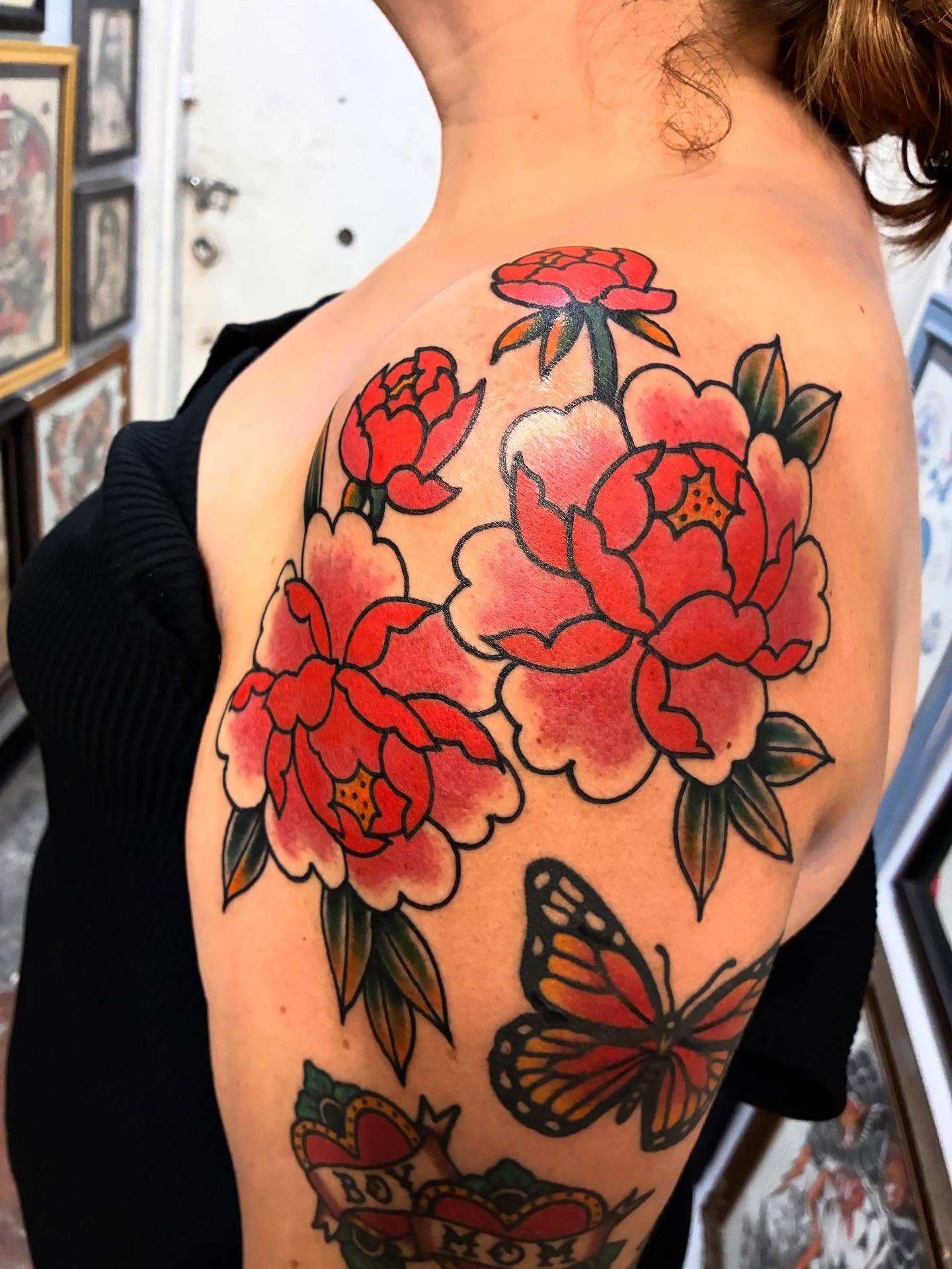 Peonies and butterfly American traditional tattoo on the shoulder by Chrissie