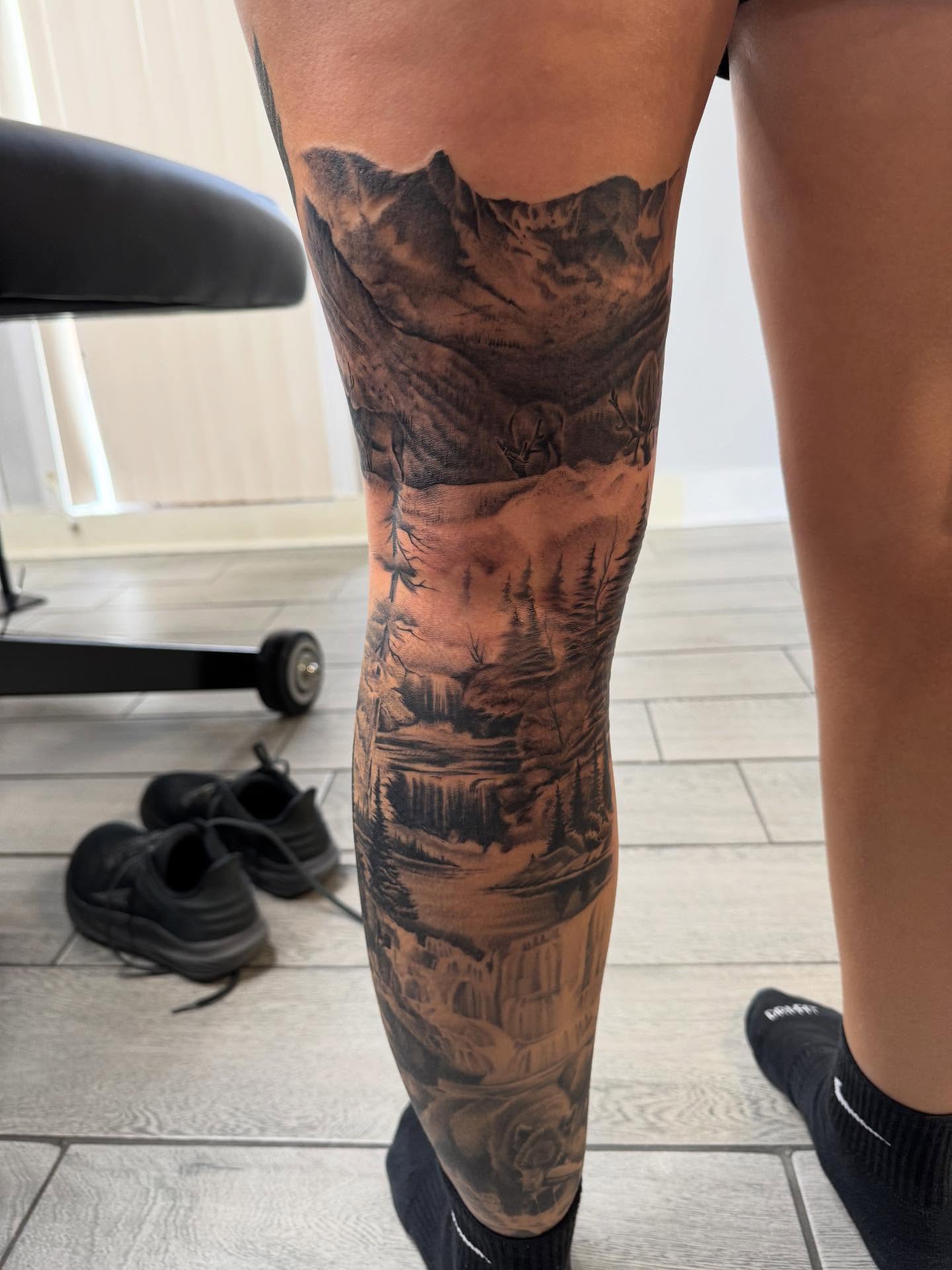 Landscape realism tattoo on the calf by Joey Flaherty