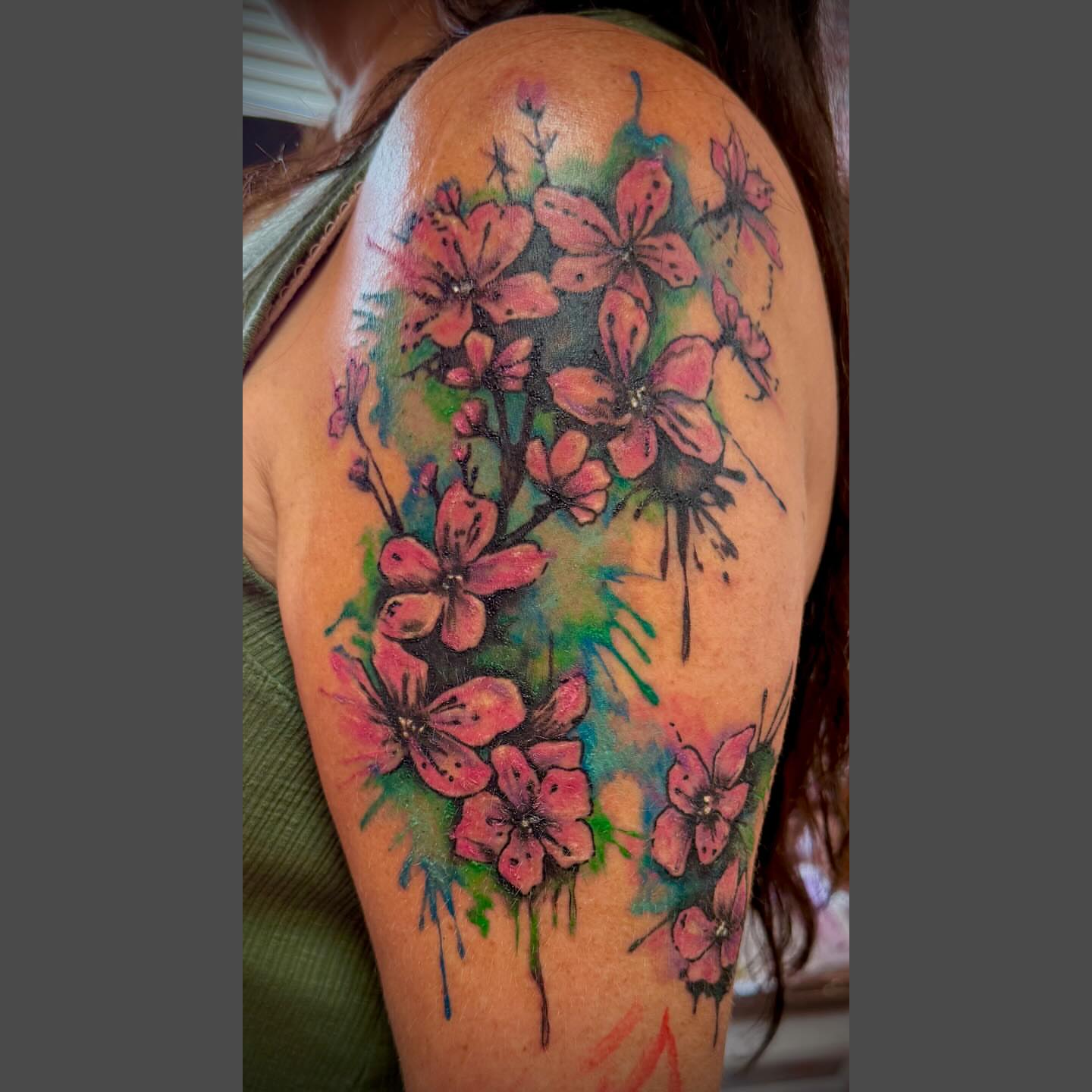 Cherry blossoms watercolor tattoo on the shoulder by Richard Nagy, New Orleans, Louisiana