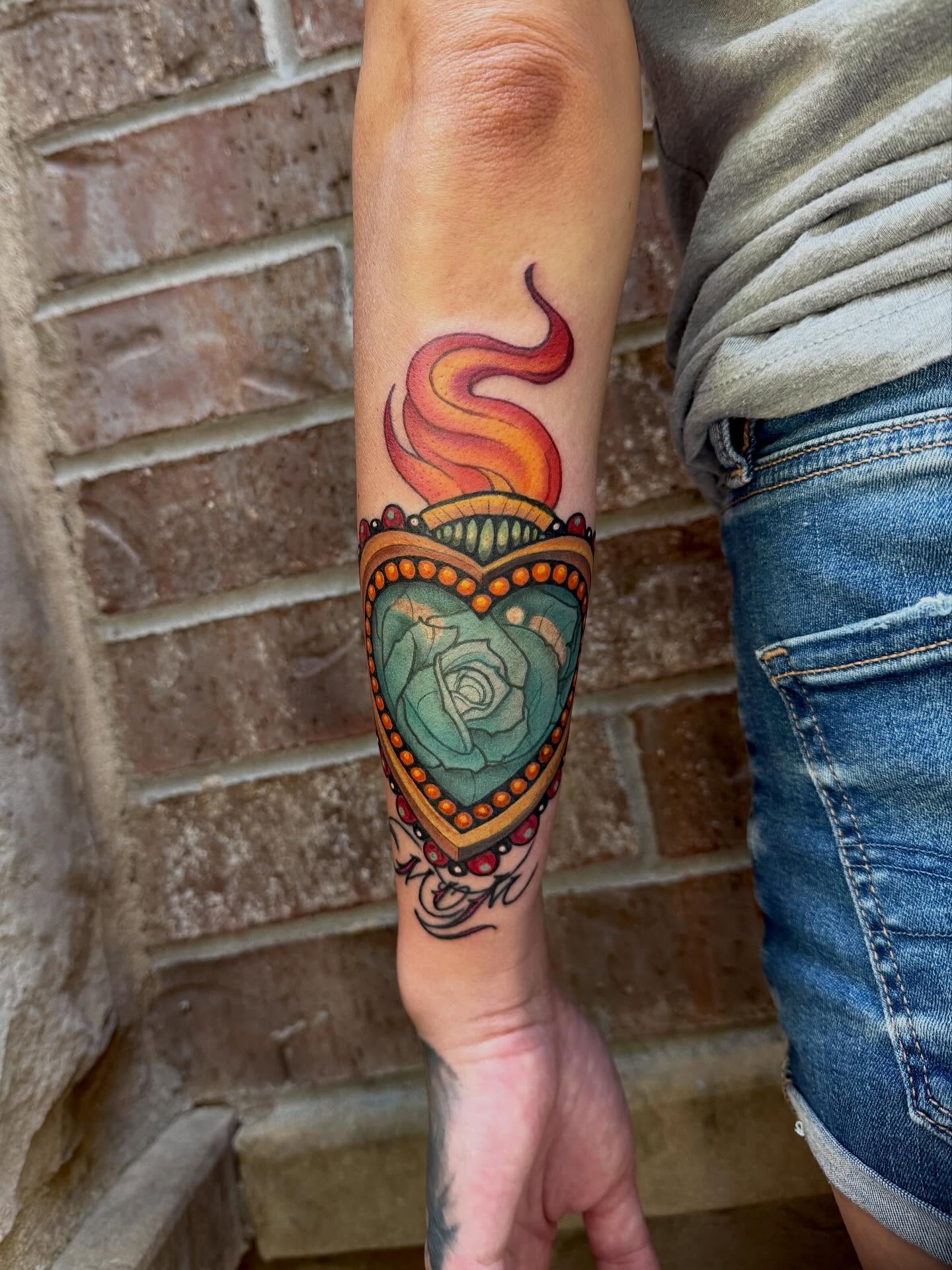 Heart with rose and flames neo-traditional tattoo on the forearm by Ty Pallotta, Austin, Texas