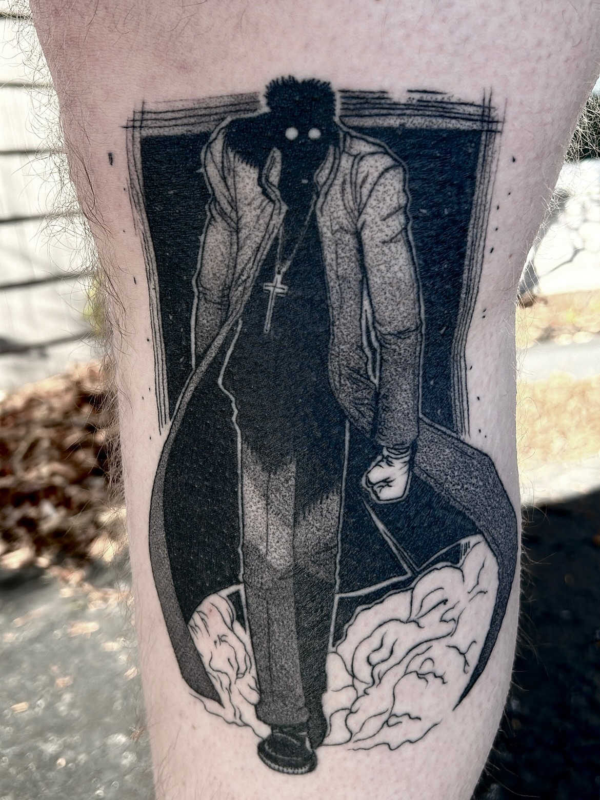 Man in trench coat black and grey tattoo on the forearm by Roman Butryy