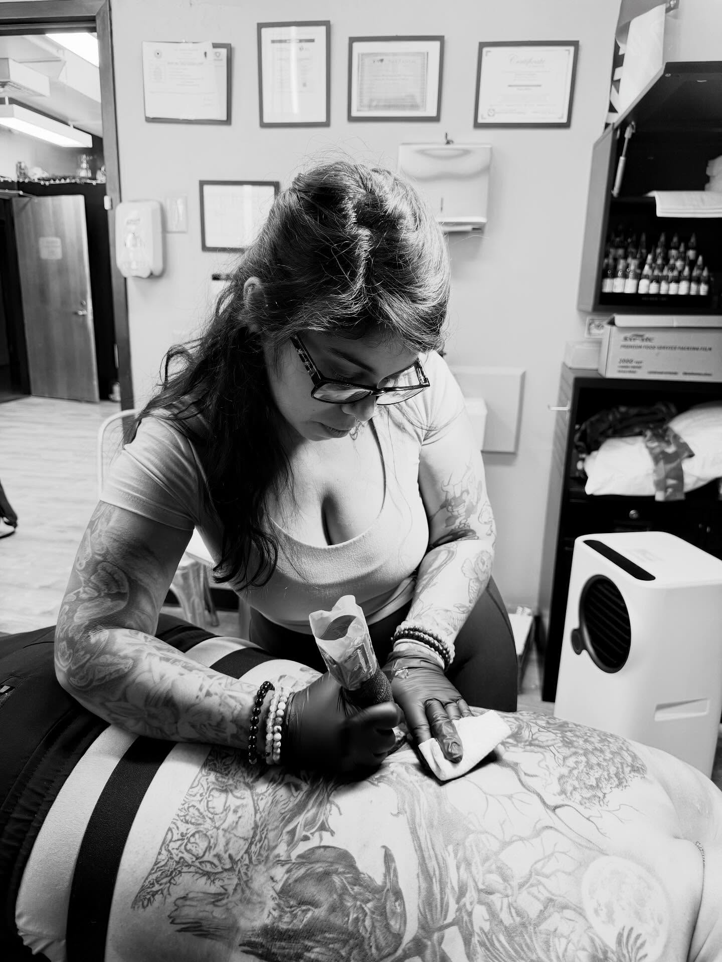 Floral design black and grey tattoo on the torso by Diana Guillette
