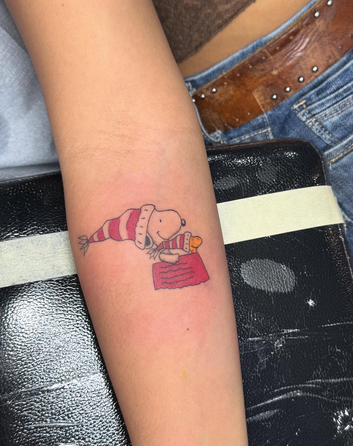 Snoopy dotwork tattoo on the forearm by Nathalie Briseno