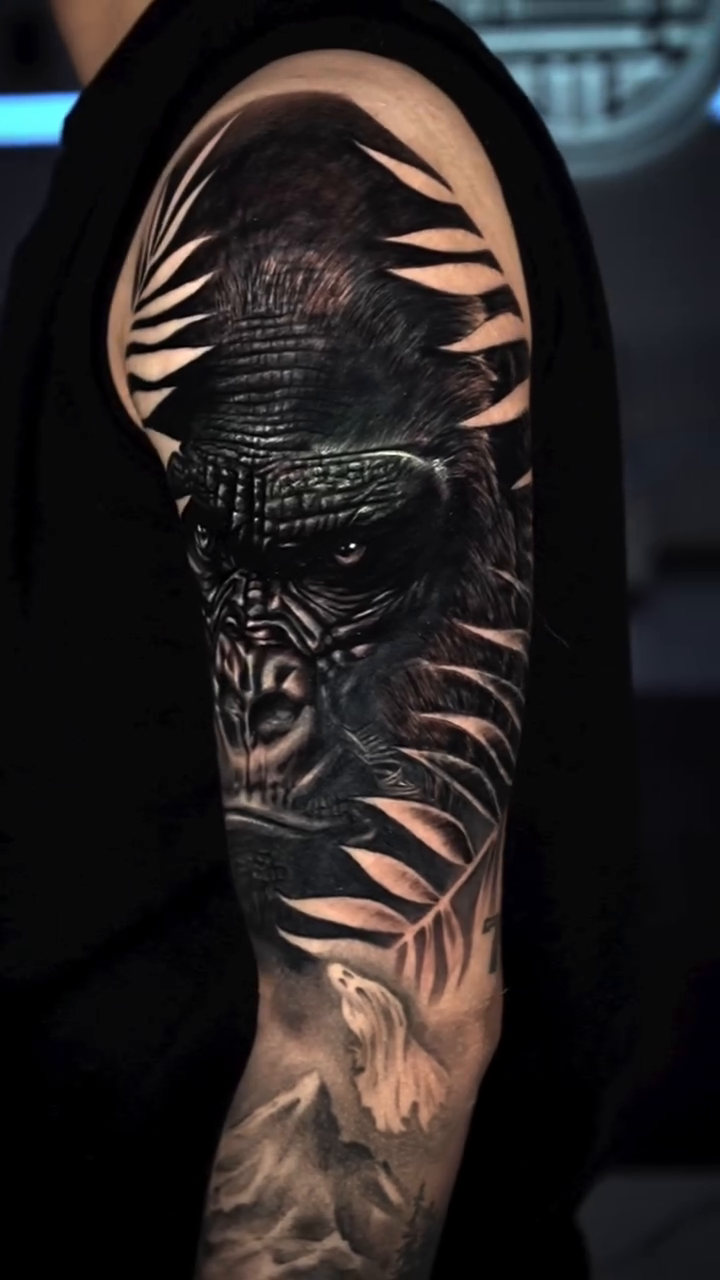 Gorilla portrait with foliage realism tattoo by Keebs