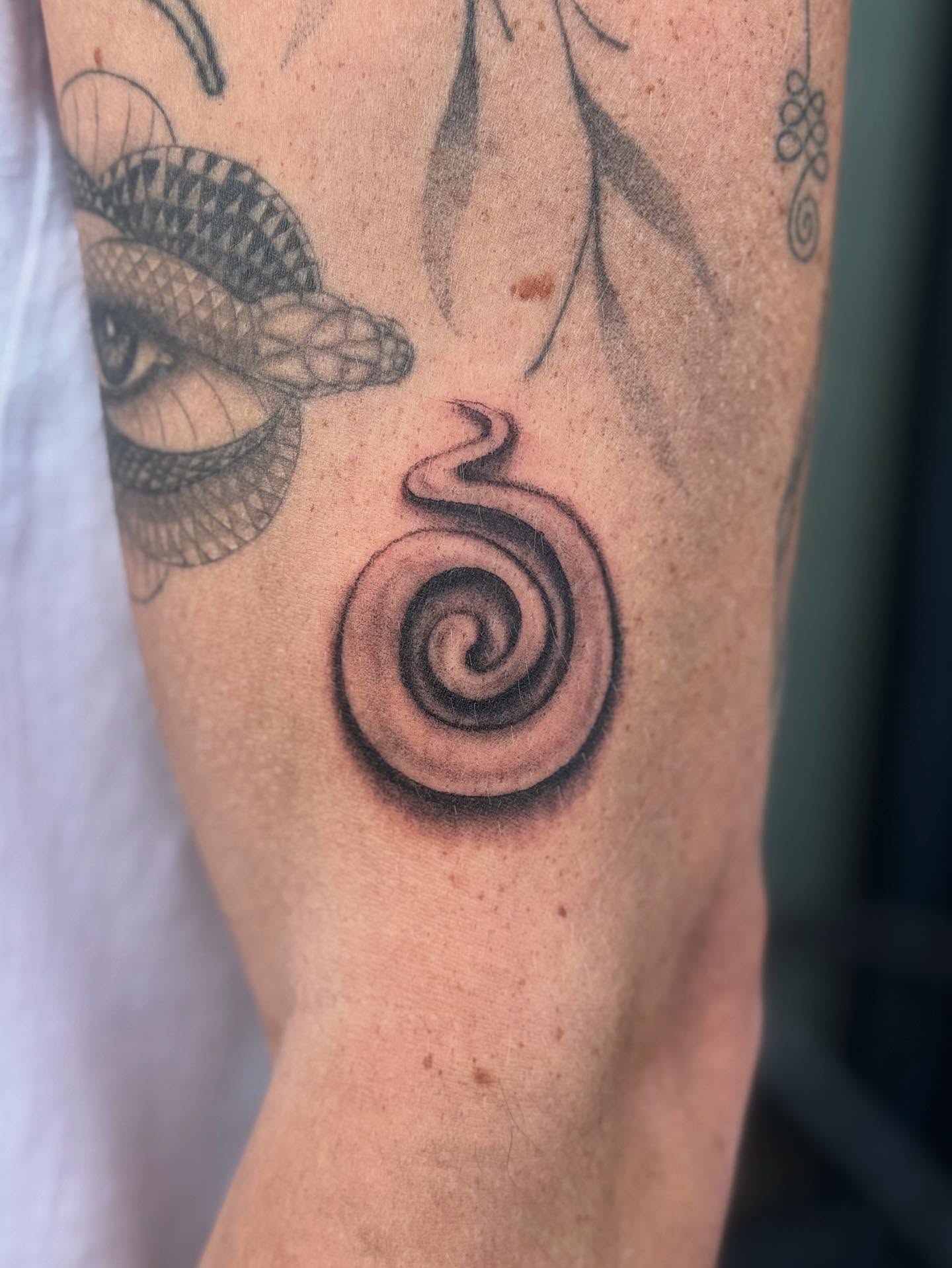 Spiral black and grey tattoo on the forearm by @mr.smiley___