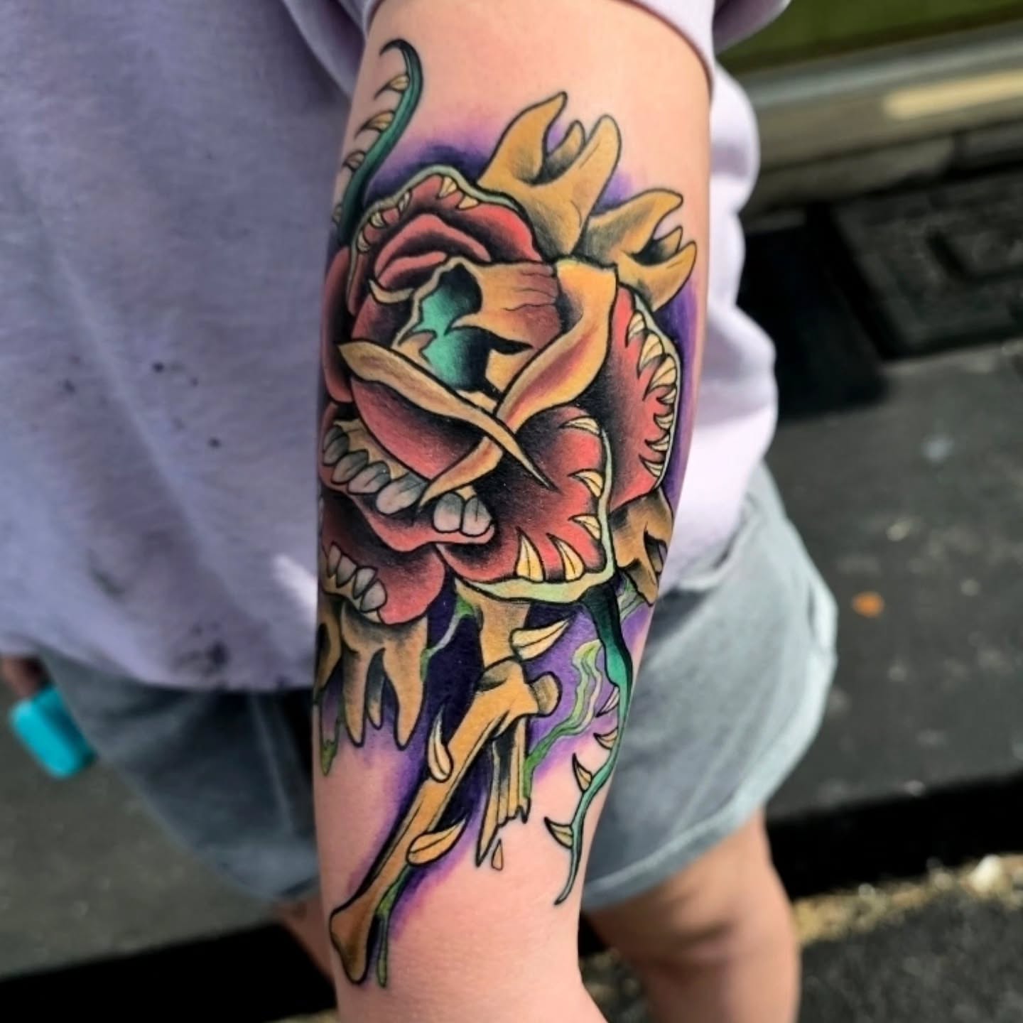 Rose and skull American traditional tattoo on the forearm by Michael Latendresse