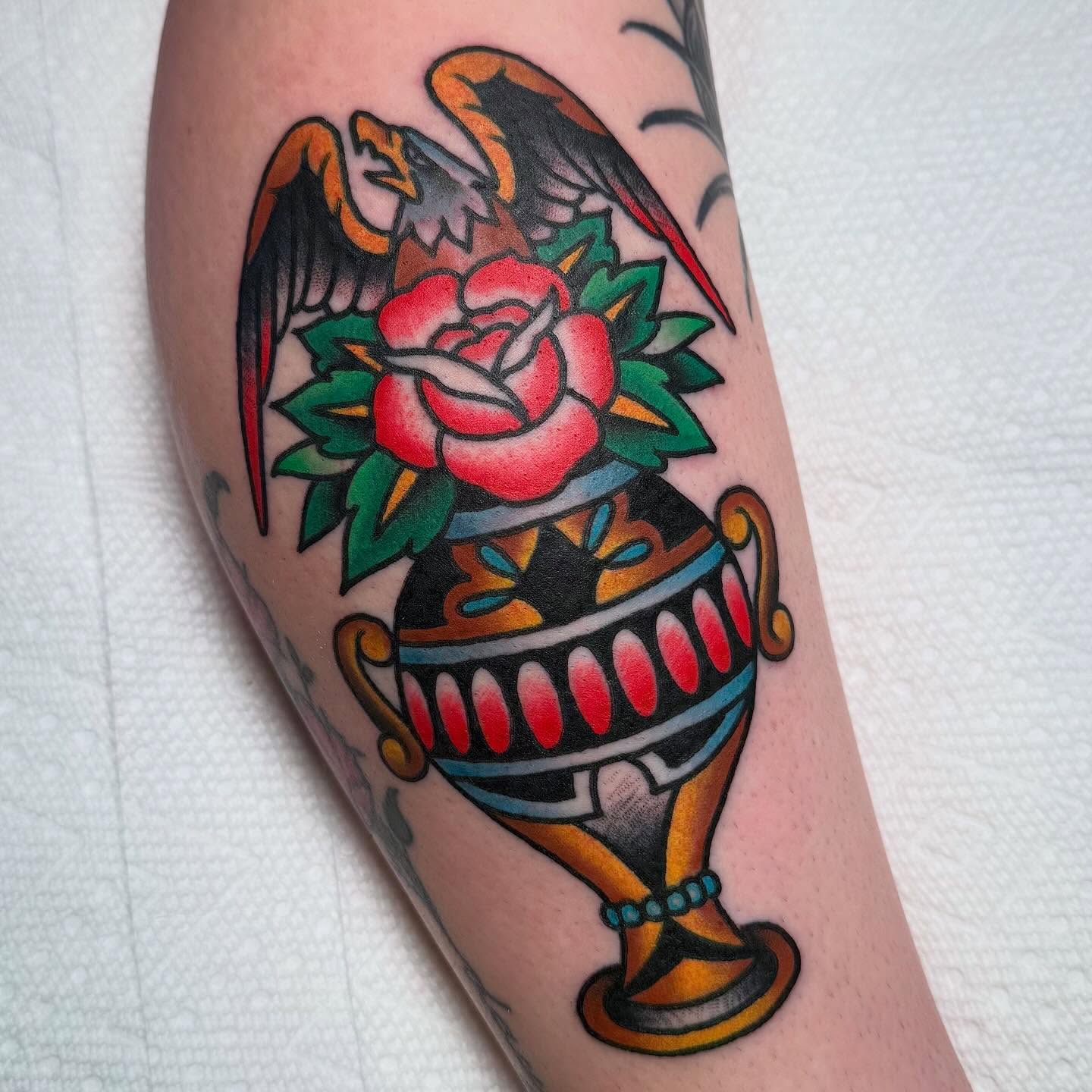 Trophy and rose American traditional tattoo on the forearm by Zach Roman, Madison, Wisconsin