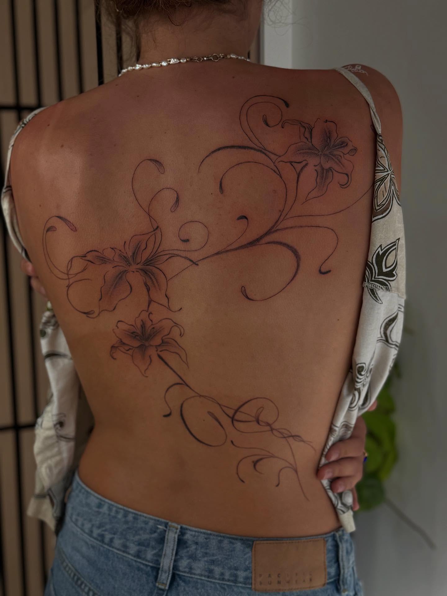 Lilies and swirls black and grey tattoo on the back by thuy (twee) <3, San Jose, California