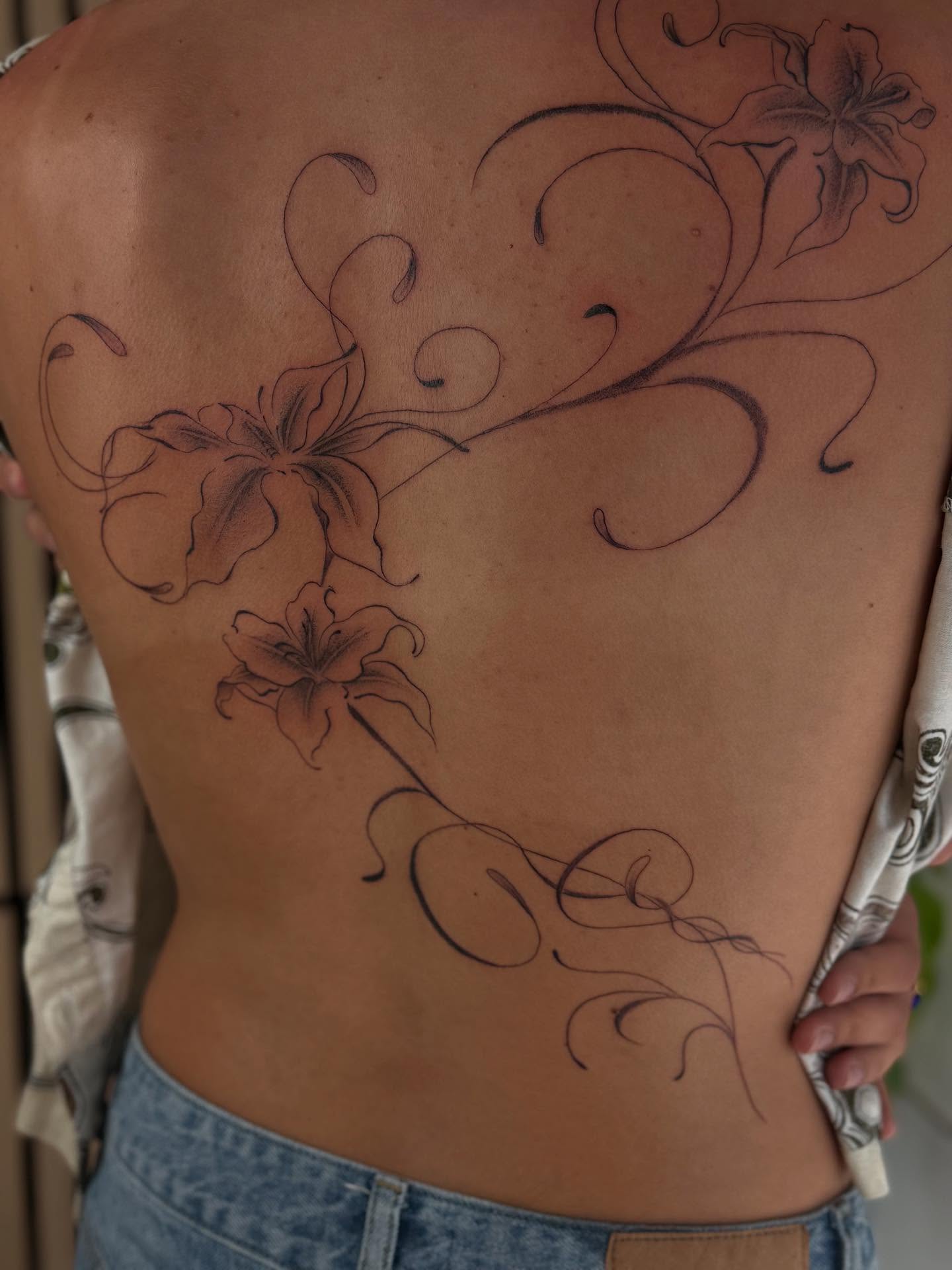 Lilies and swirls black and grey tattoo on the back by thuy (twee) <3, San Jose, California