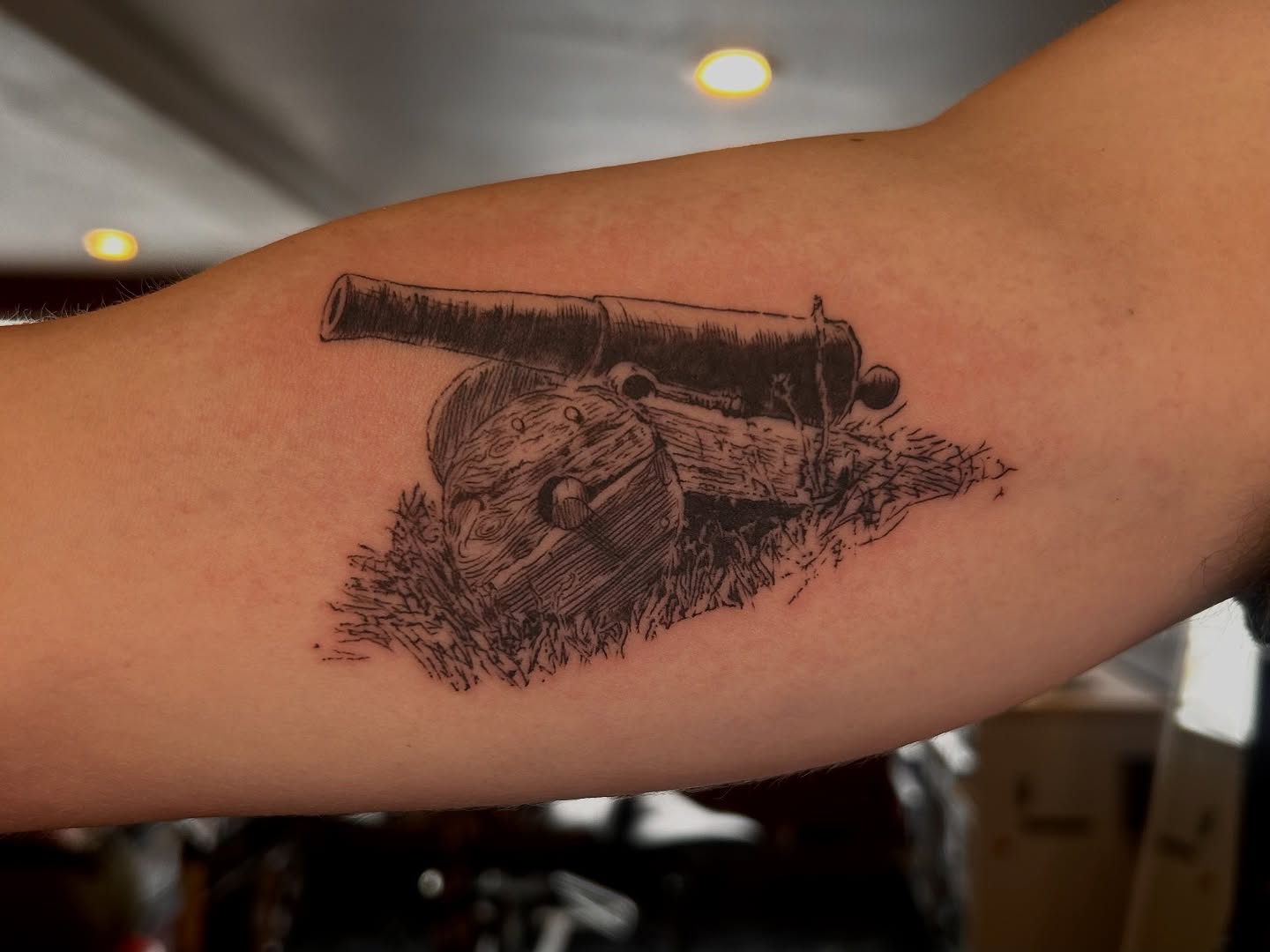 Cannon black and grey tattoo on the forearm by King By Trade 👑