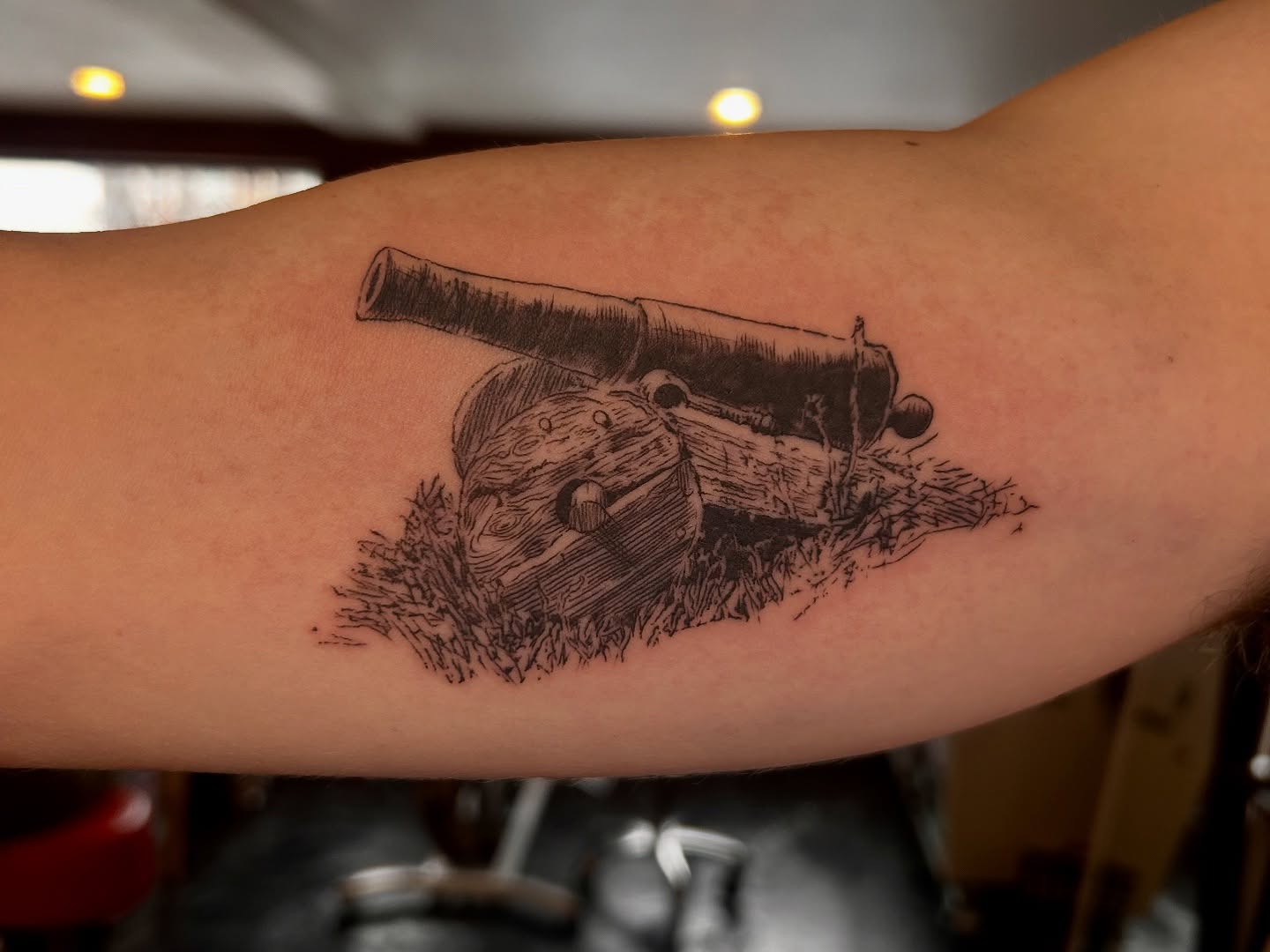 Cannon black and grey tattoo on the forearm by King By Trade 👑