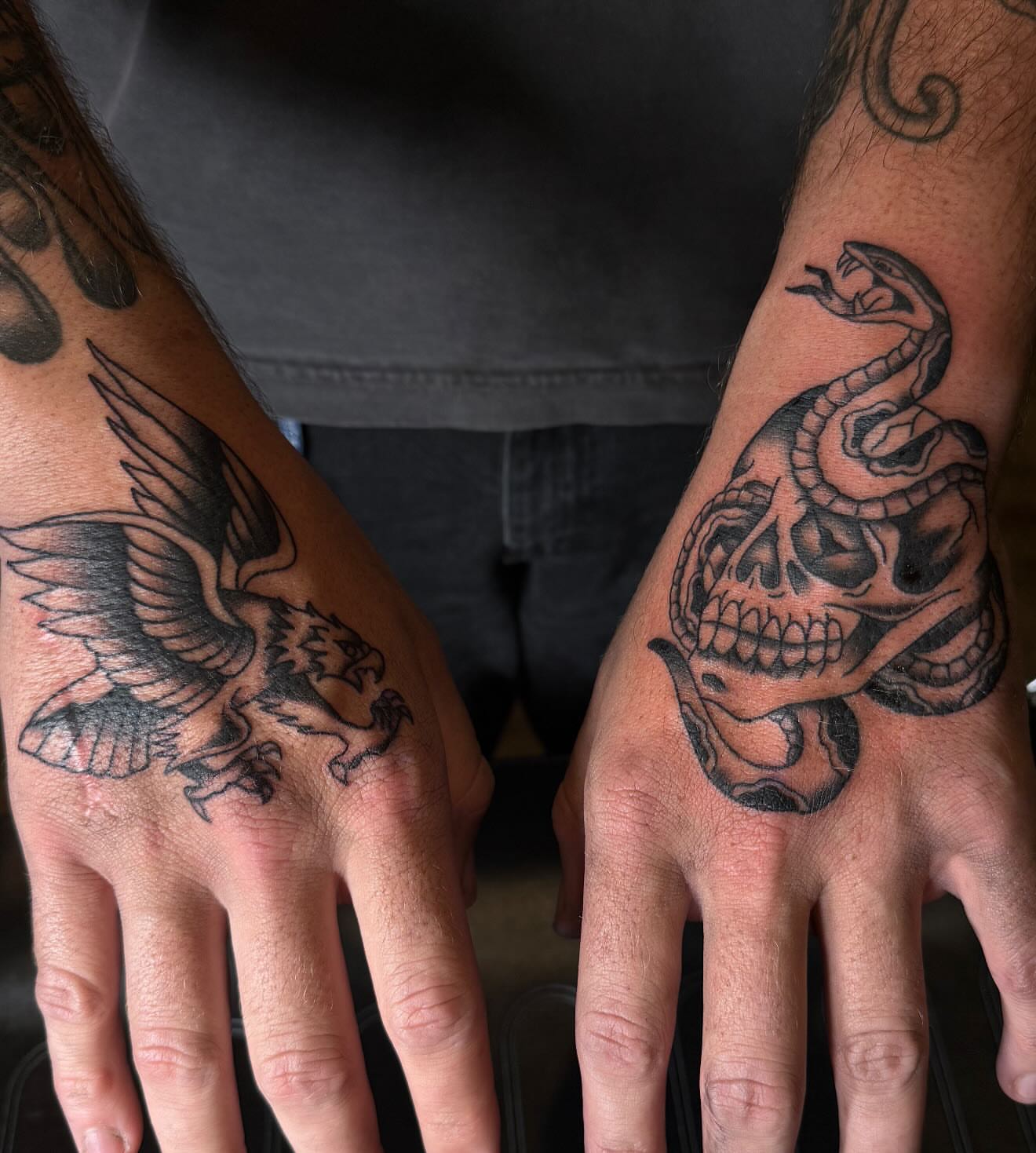 Eagle and snake black and grey tattoo on the hand by frankie quadrini