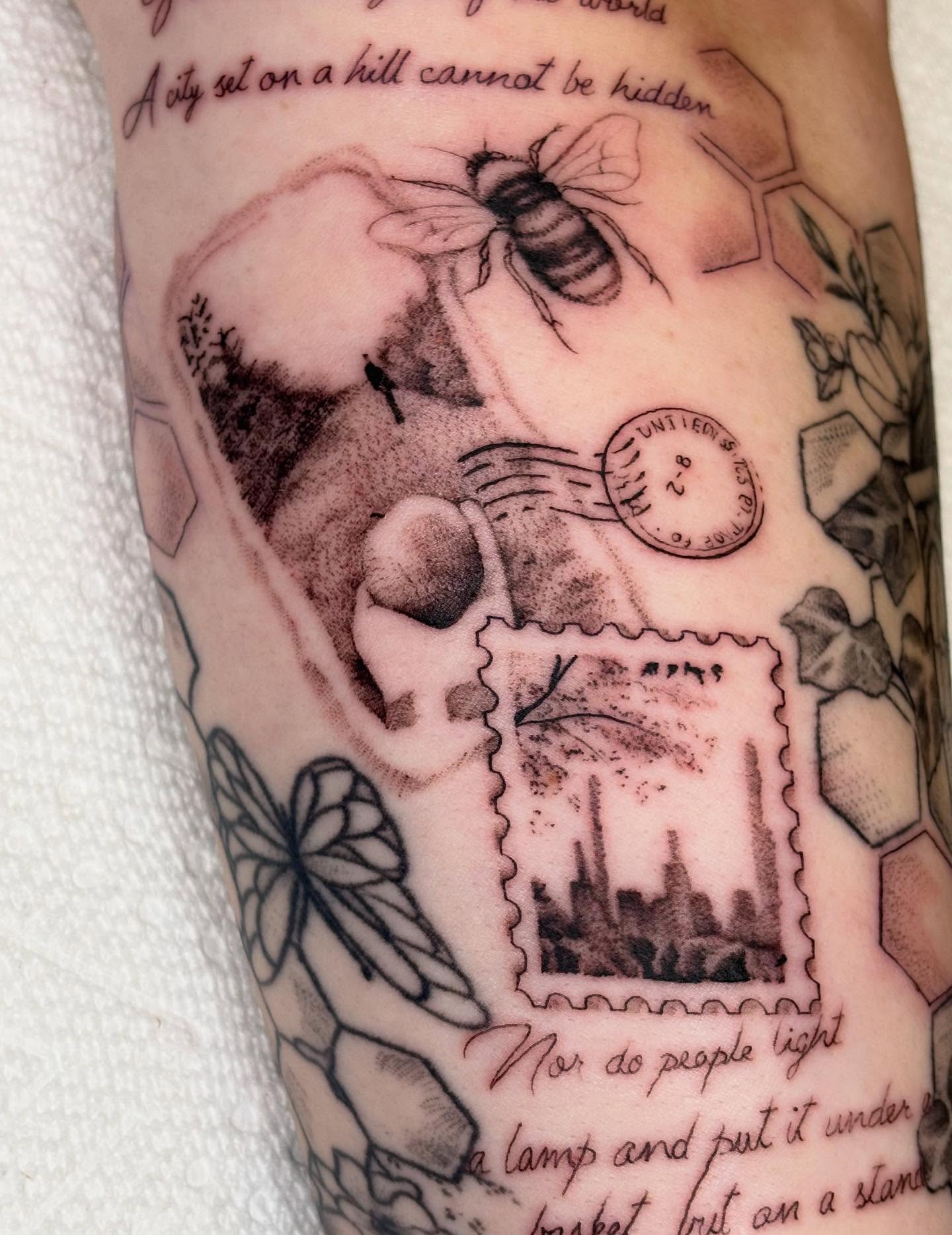 Cityscape postage stamp realism tattoo on the forearm by Harley Lane ๐ซ