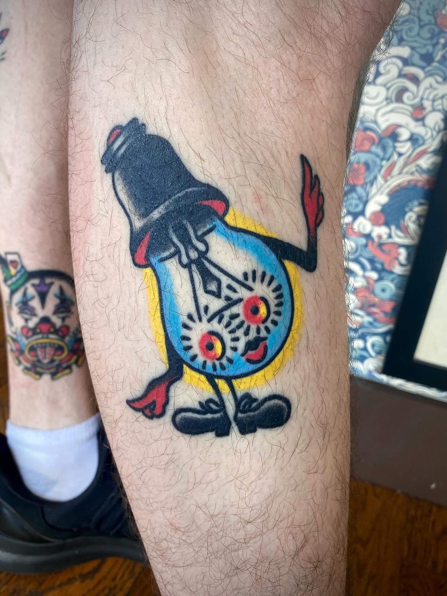 Light bulb American traditional tattoo on the forearm by Jack, Knoxville, Tennessee