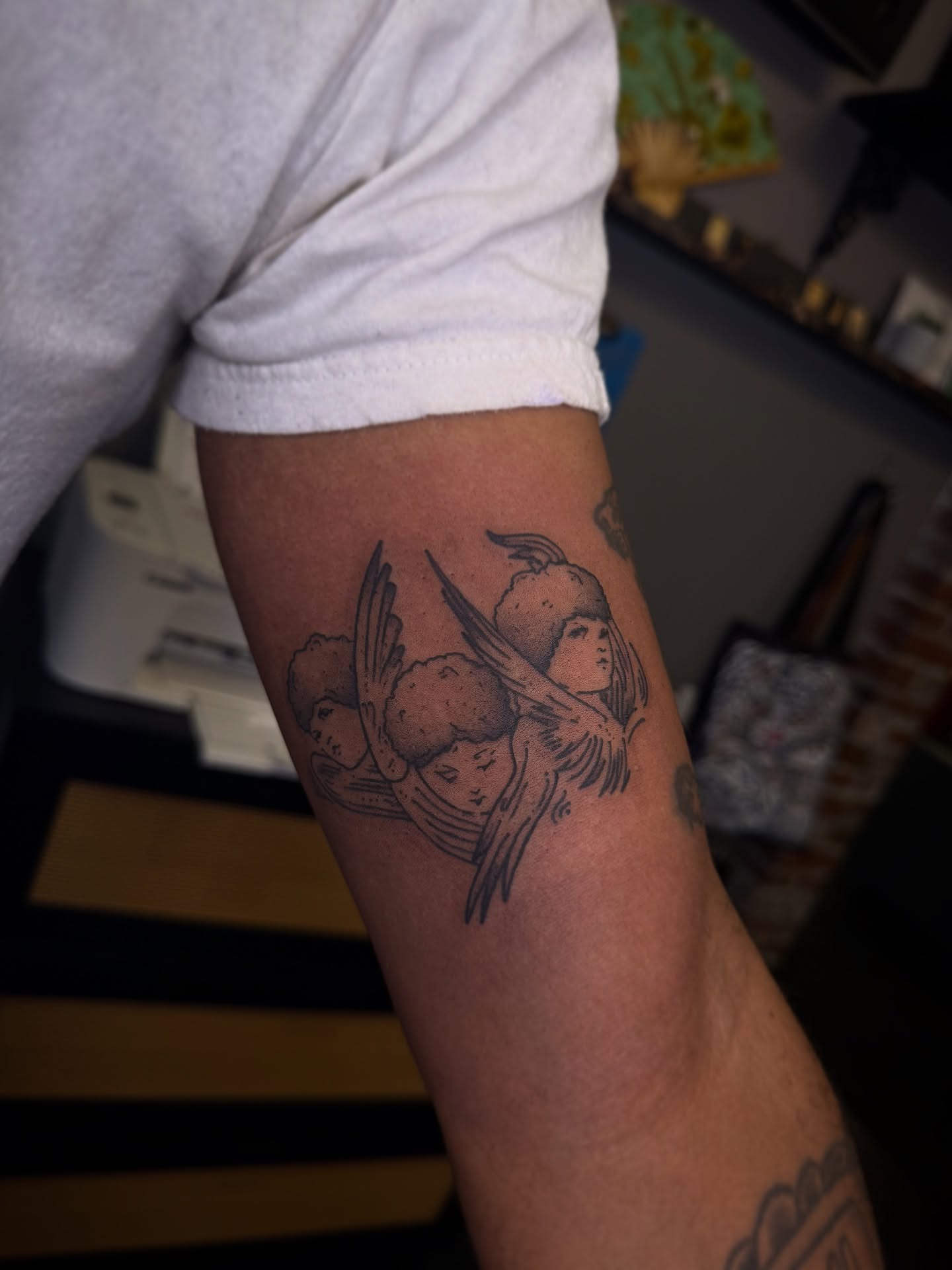 Angels black and grey tattoo on the forearm by Eden H., Columbus, Ohio