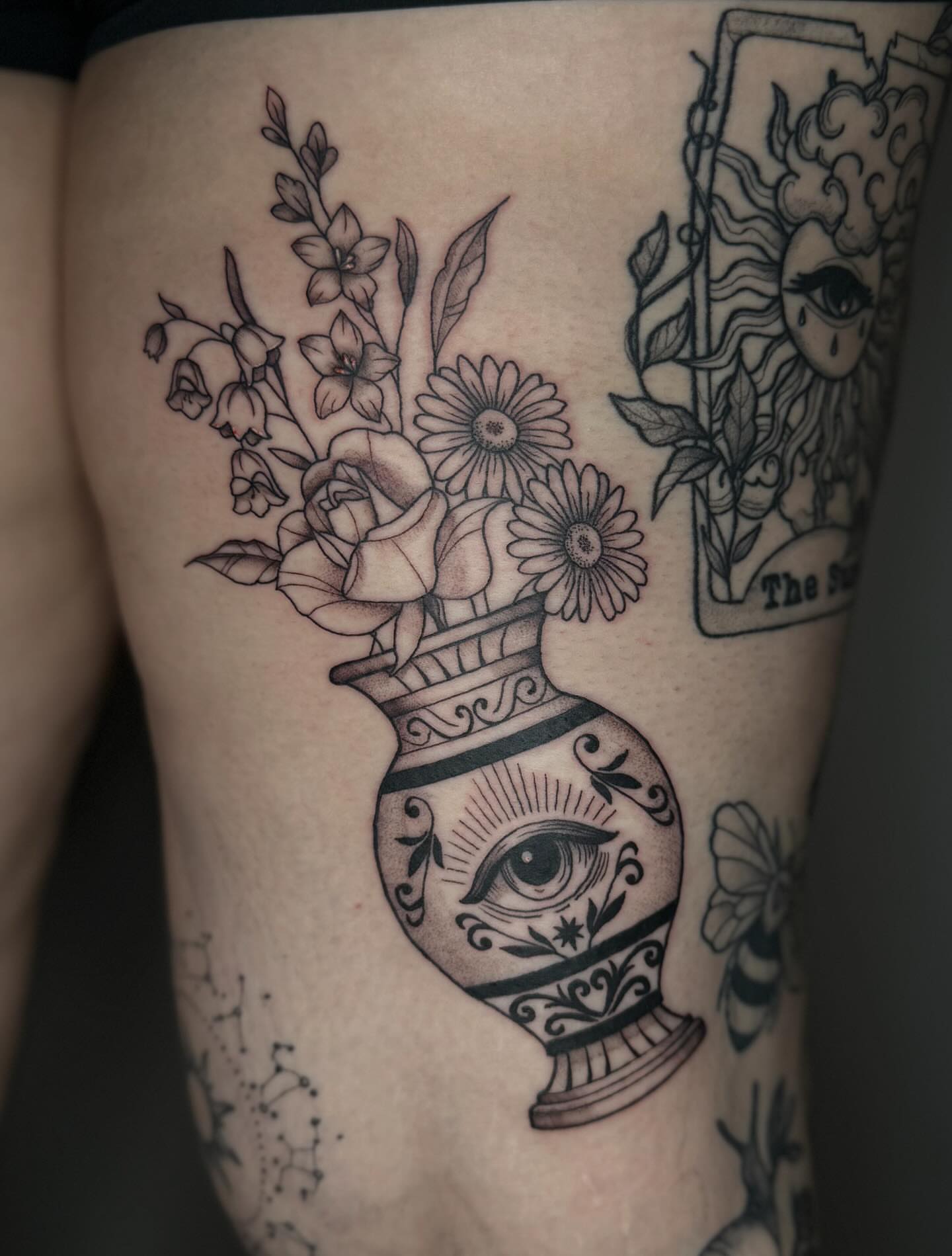 Vase with flowers ornamental tattoo on the thigh by Brandi 🕷, Mentor, Ohio