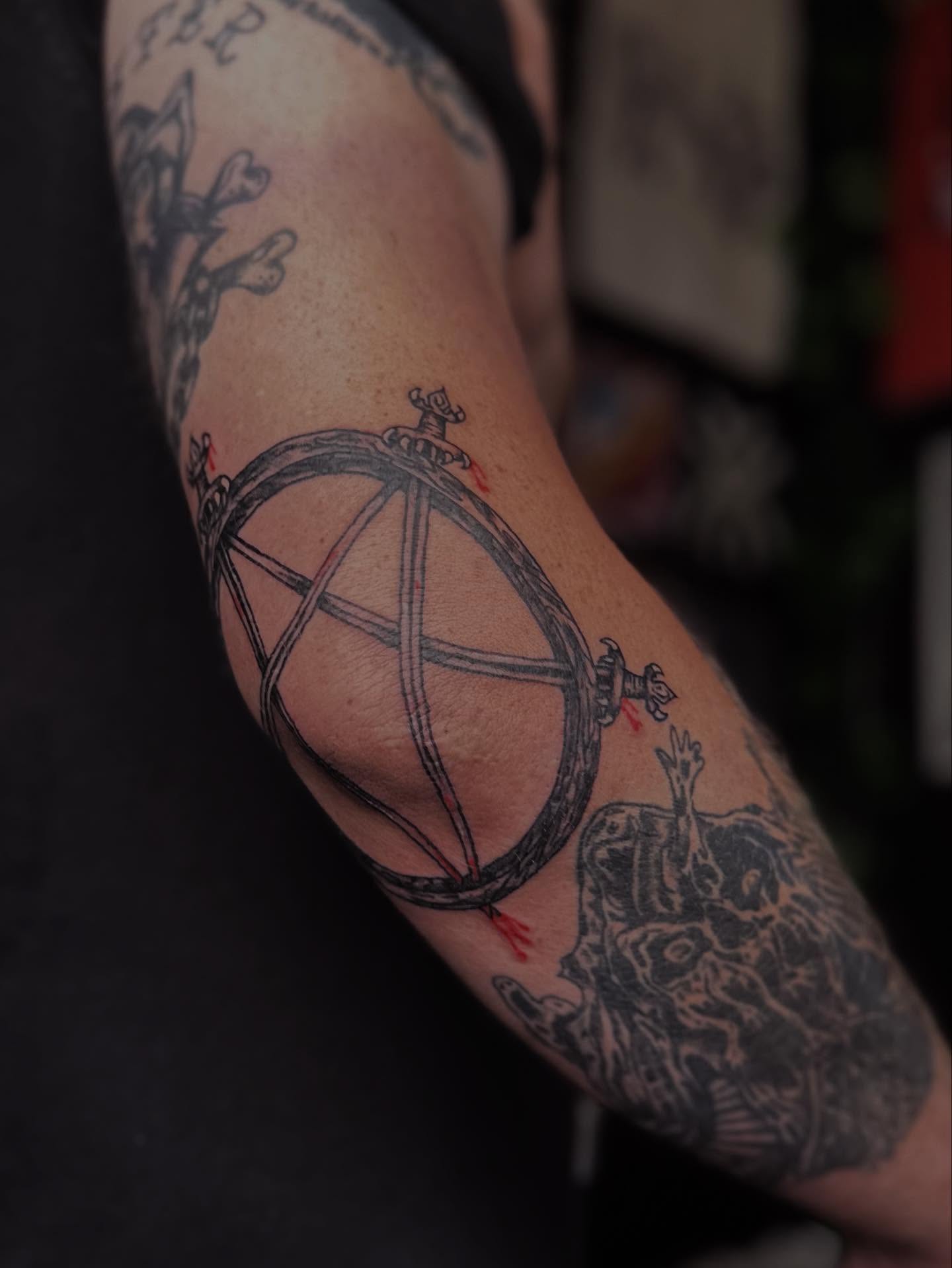 Geometric sphere geometric tattoo on the forearm by Brooke