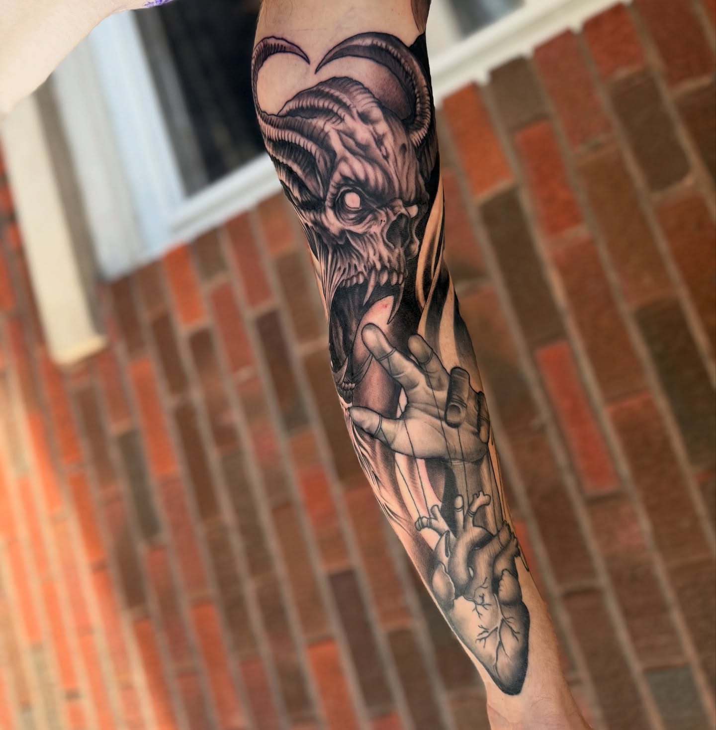 Monster heart dark realism tattoo on the forearm by Jeremy Utley