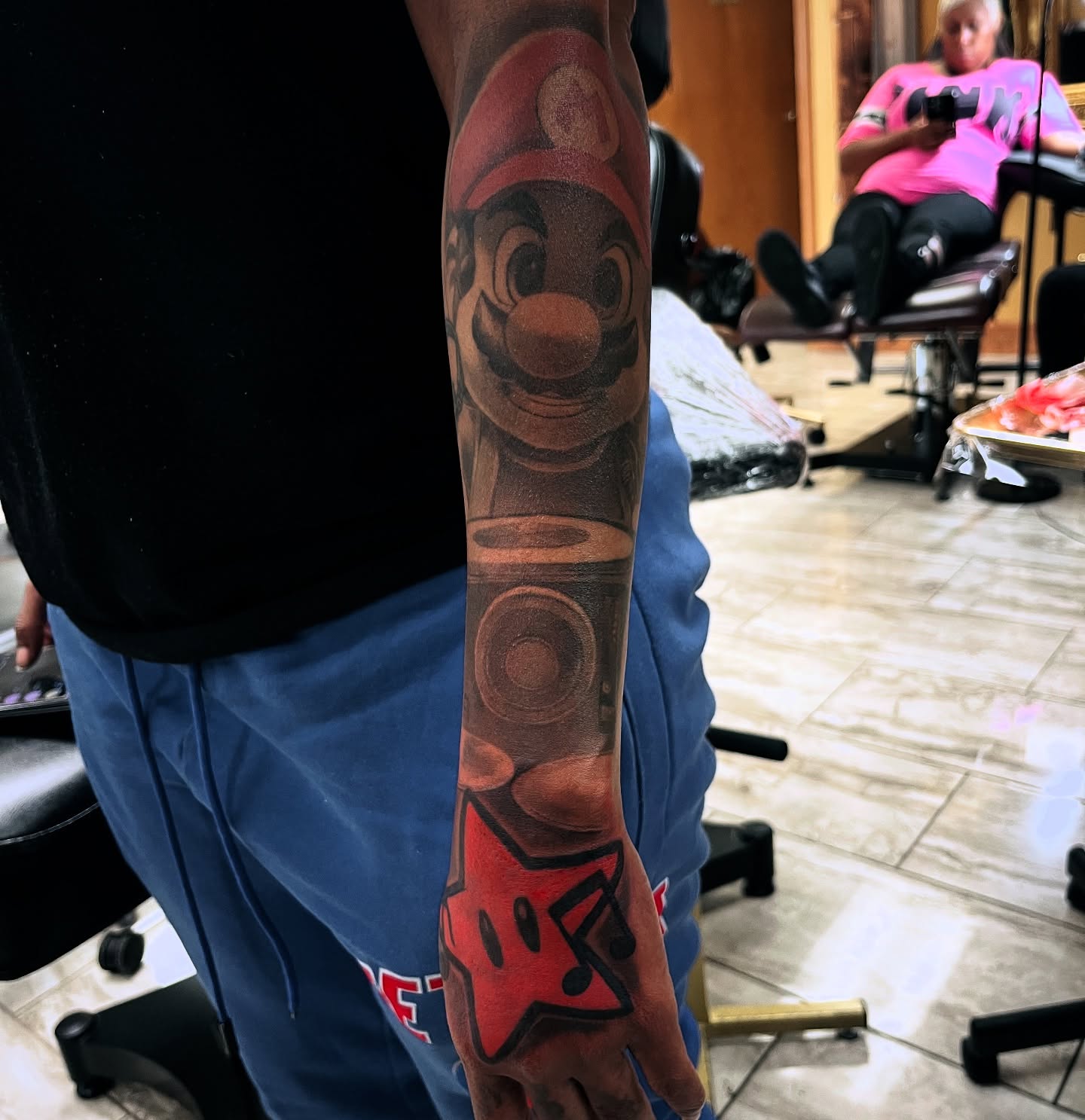 Mario realism tattoo on the forearm by Quinten Harper