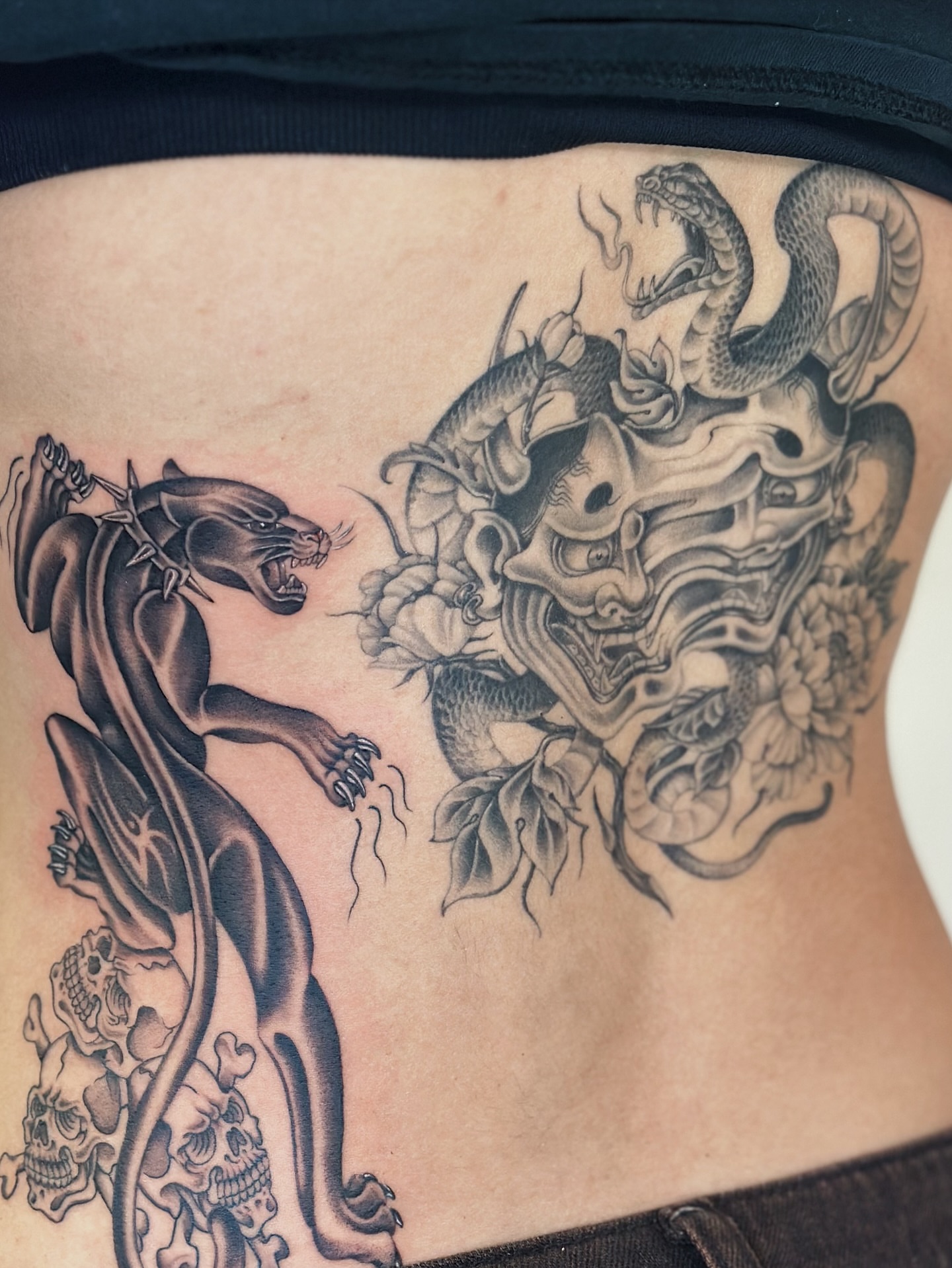 Panther and demon mask japanese irezumi tattoo on the ribs by Lauryn Jenesis