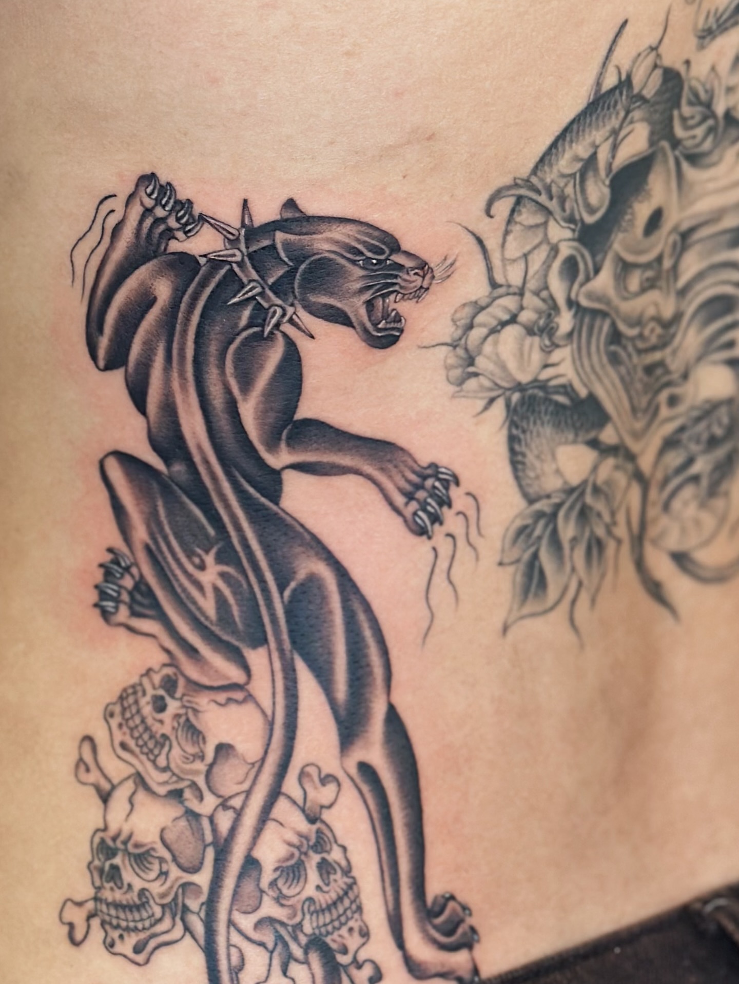 Panther and dragon realism tattoo on the ribs by Lauryn Jenesis