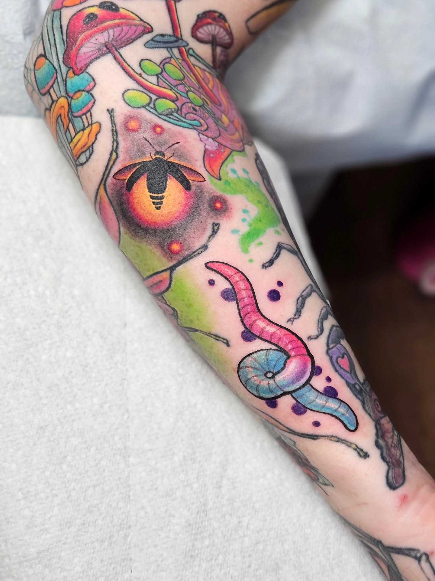 Mushroom and bee new school tattoo on the forearm by Bellz Rehder