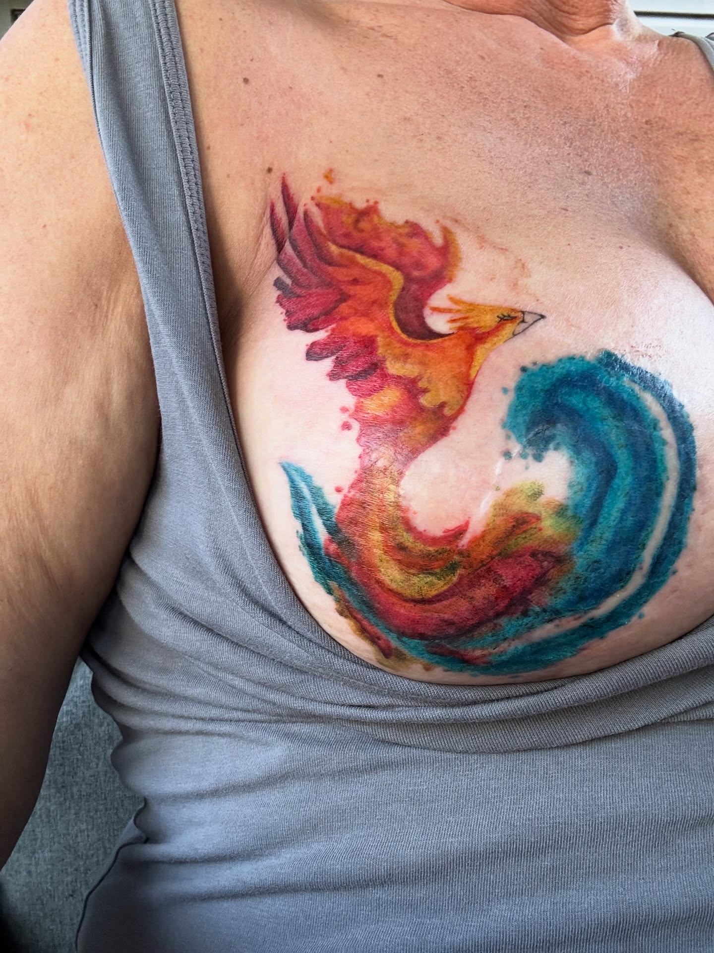 Phoenix watercolor tattoo on the chest by Kbryanttattoos, Ohio City, Ohio