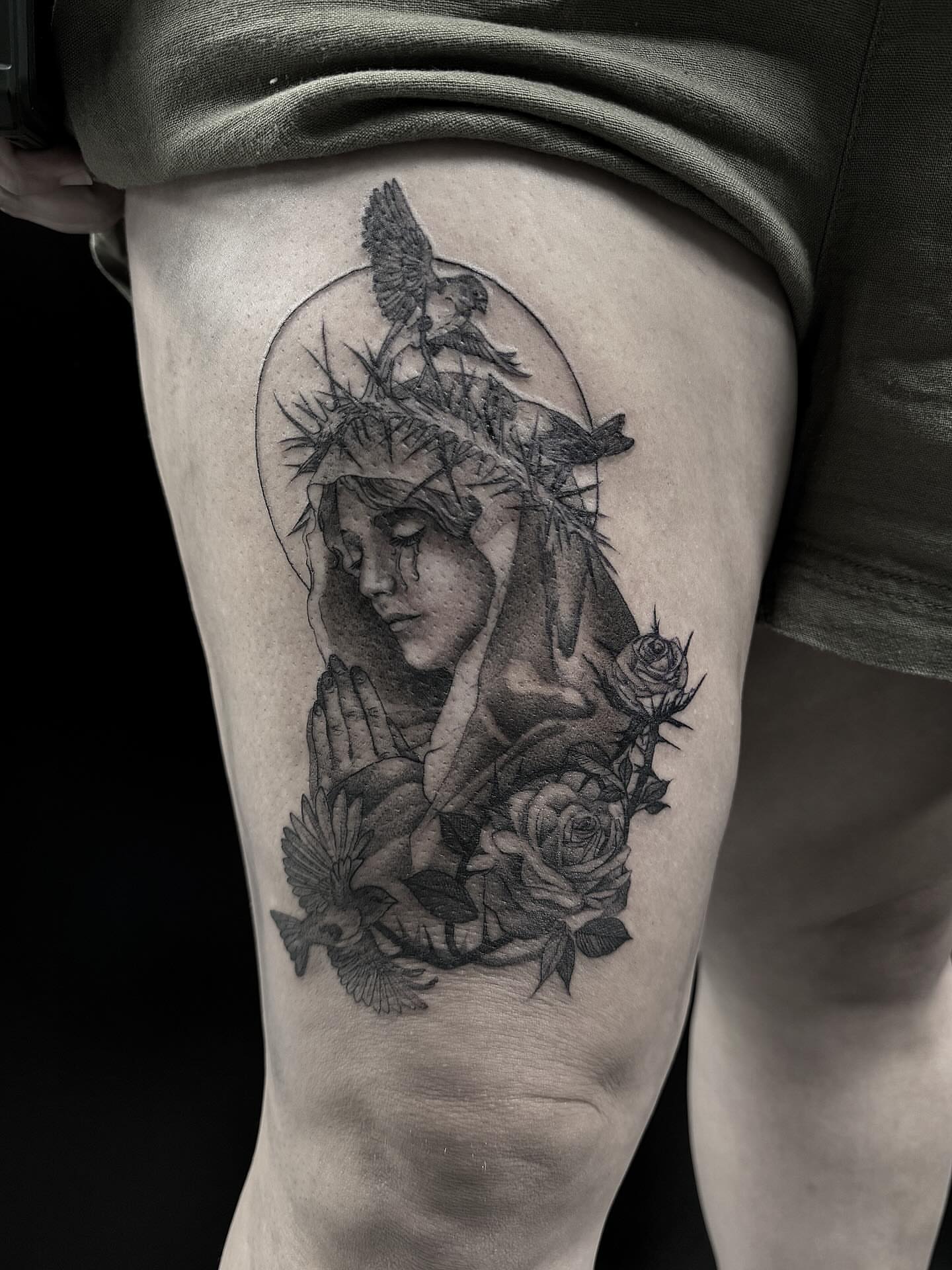 Religious figure with roses realism tattoo on the thigh by Bethbeforedishonor, Rochester, New York