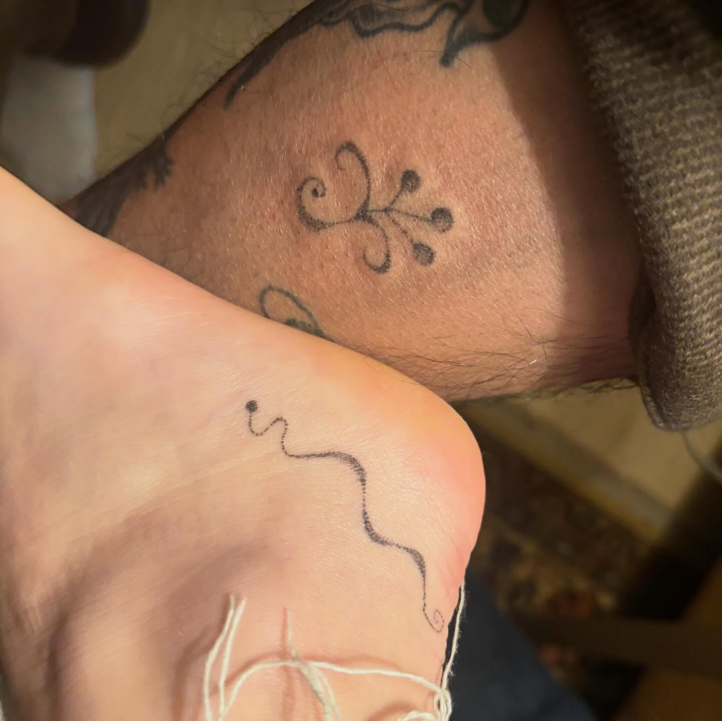Abstract swirl black and grey tattoo on the foot by kari
