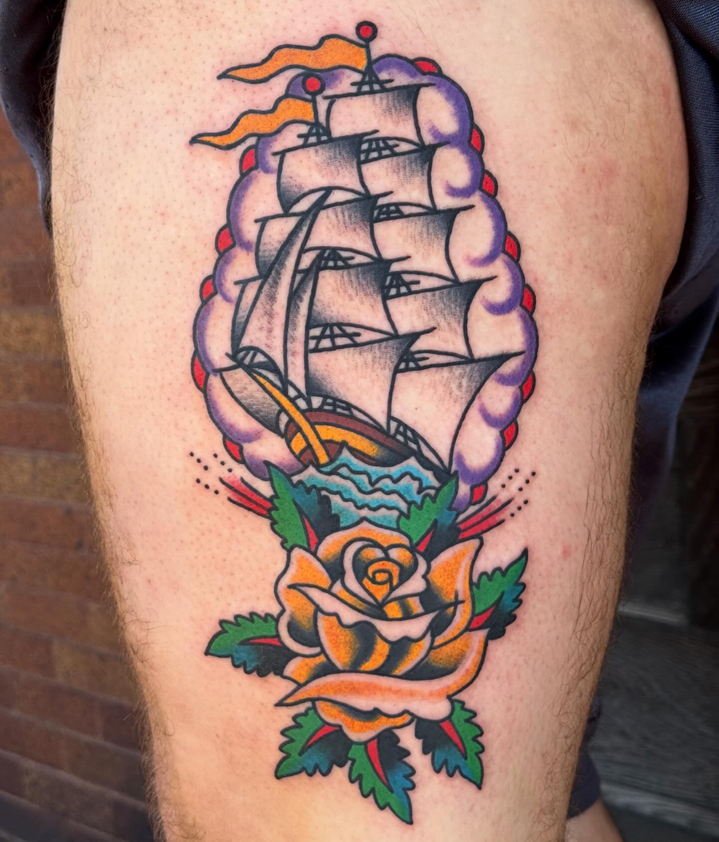 Sailboat and rose American traditional tattoo on the thigh by Sam Hambrick, Watchung NJ