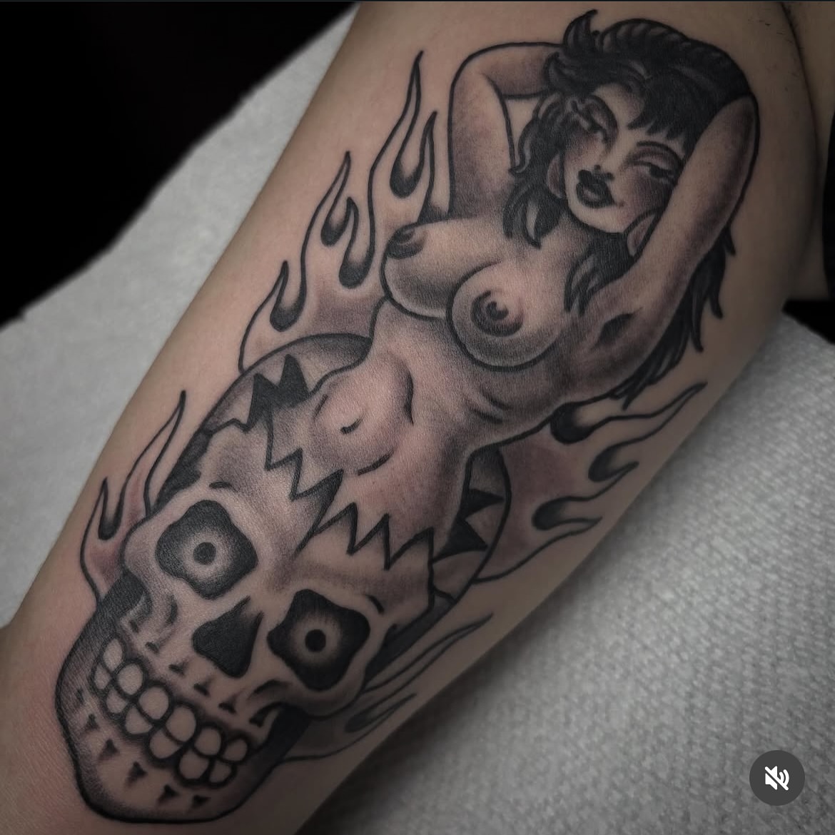 Woman with flames American traditional tattoo on the forearm by Mike Wilson