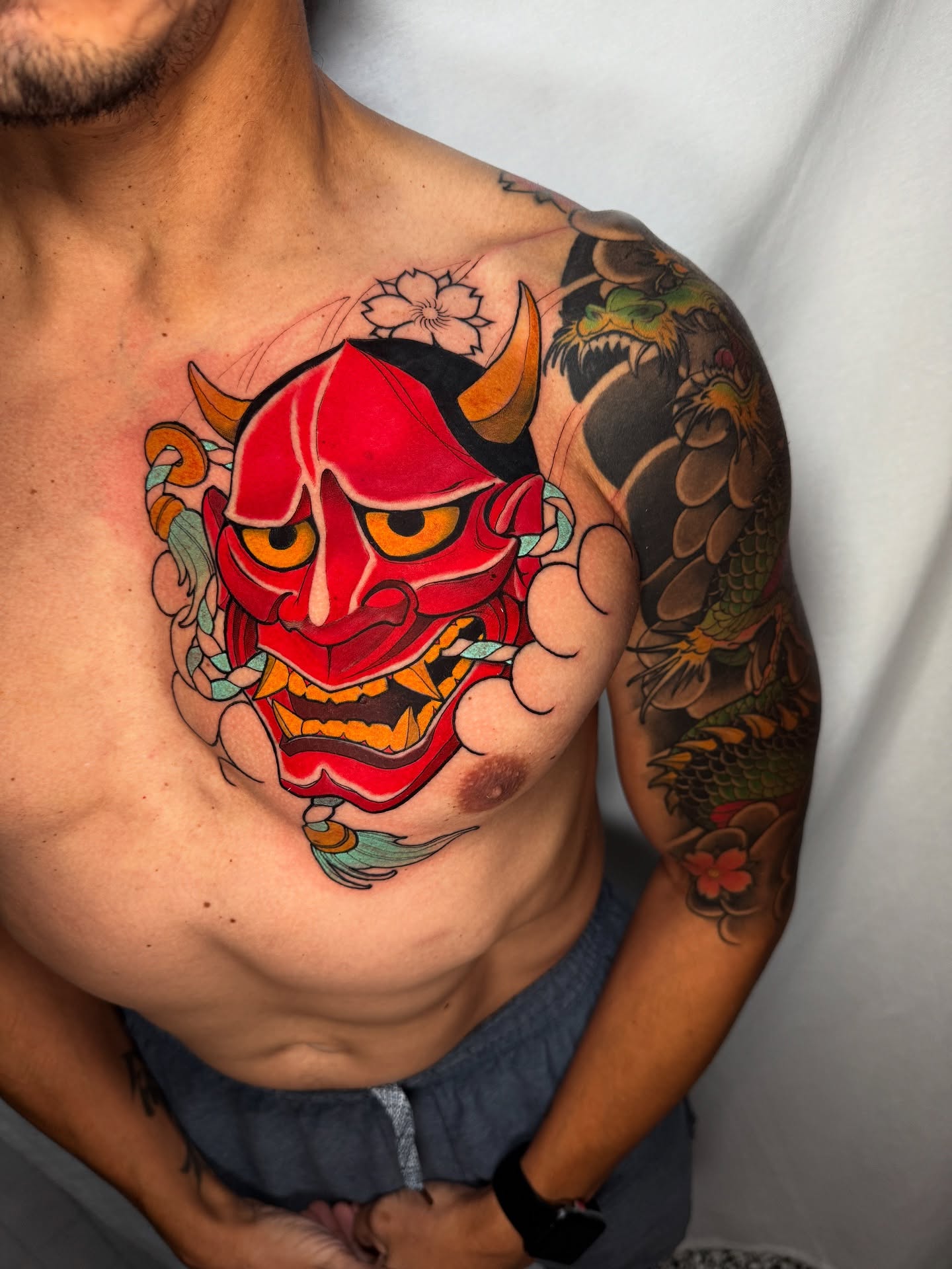 Demon mask japanese irezumi tattoo on the chest by Neotrav Tattoos