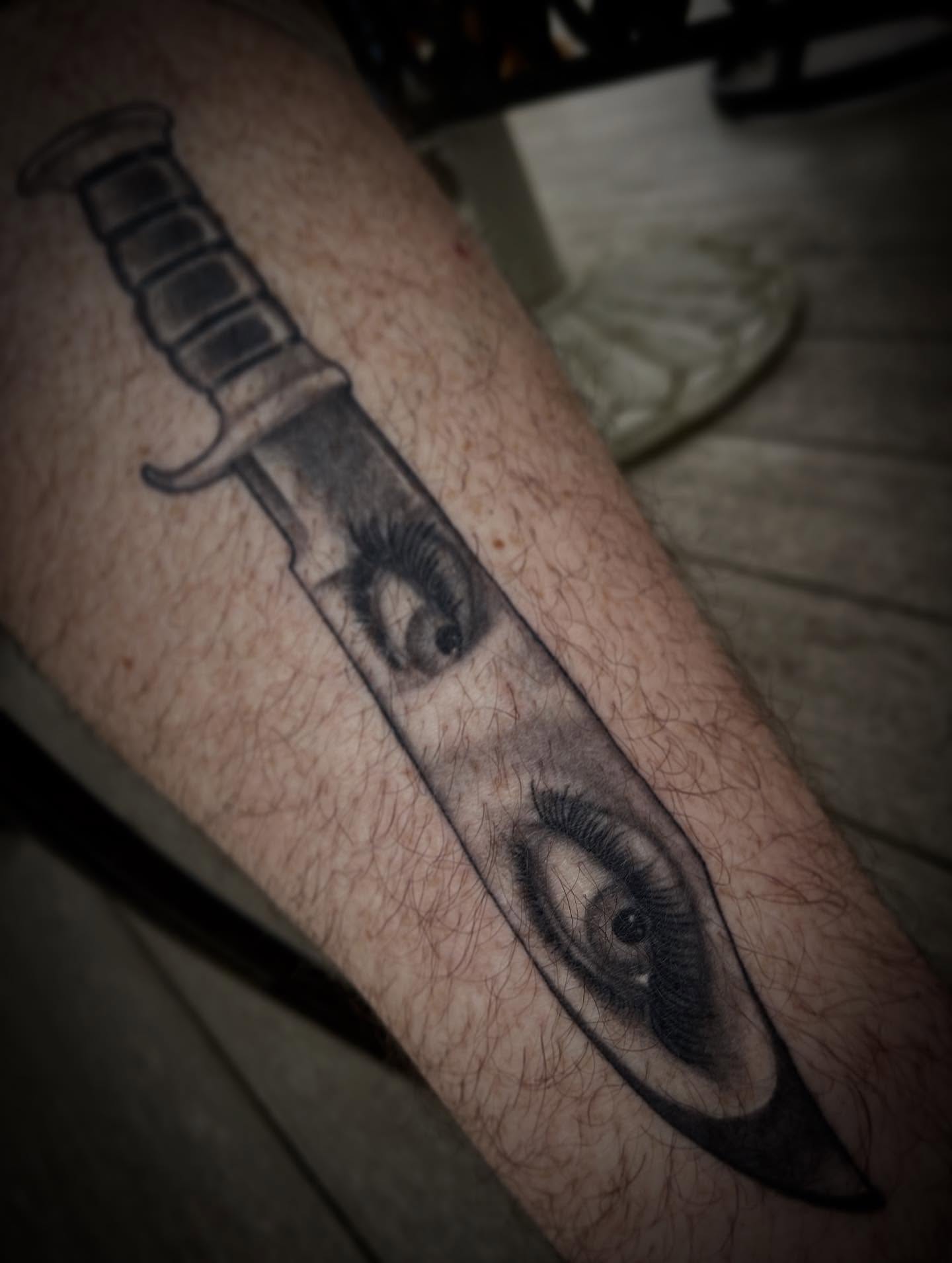 Eye and knife realism tattoo on the forearm by Jacob Finelli