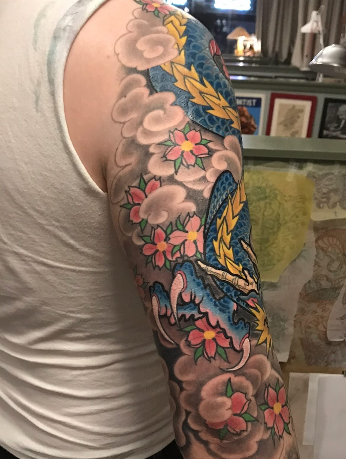 Floral and dragon japanese irezumi tattoo on the upper arm by Miles Maniaci, Chicago, Illinois